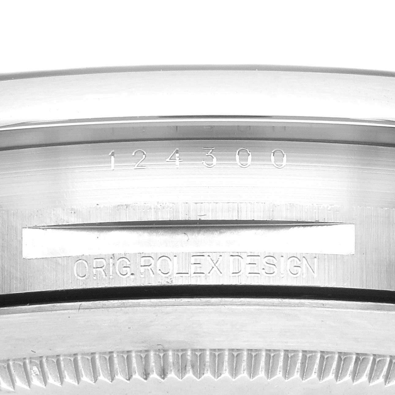 The image shows a close-up of the side of a Rolex Oyster Perpetual 124300, highlighting the model number and "Orig. Rolex Design" engraving on its case.