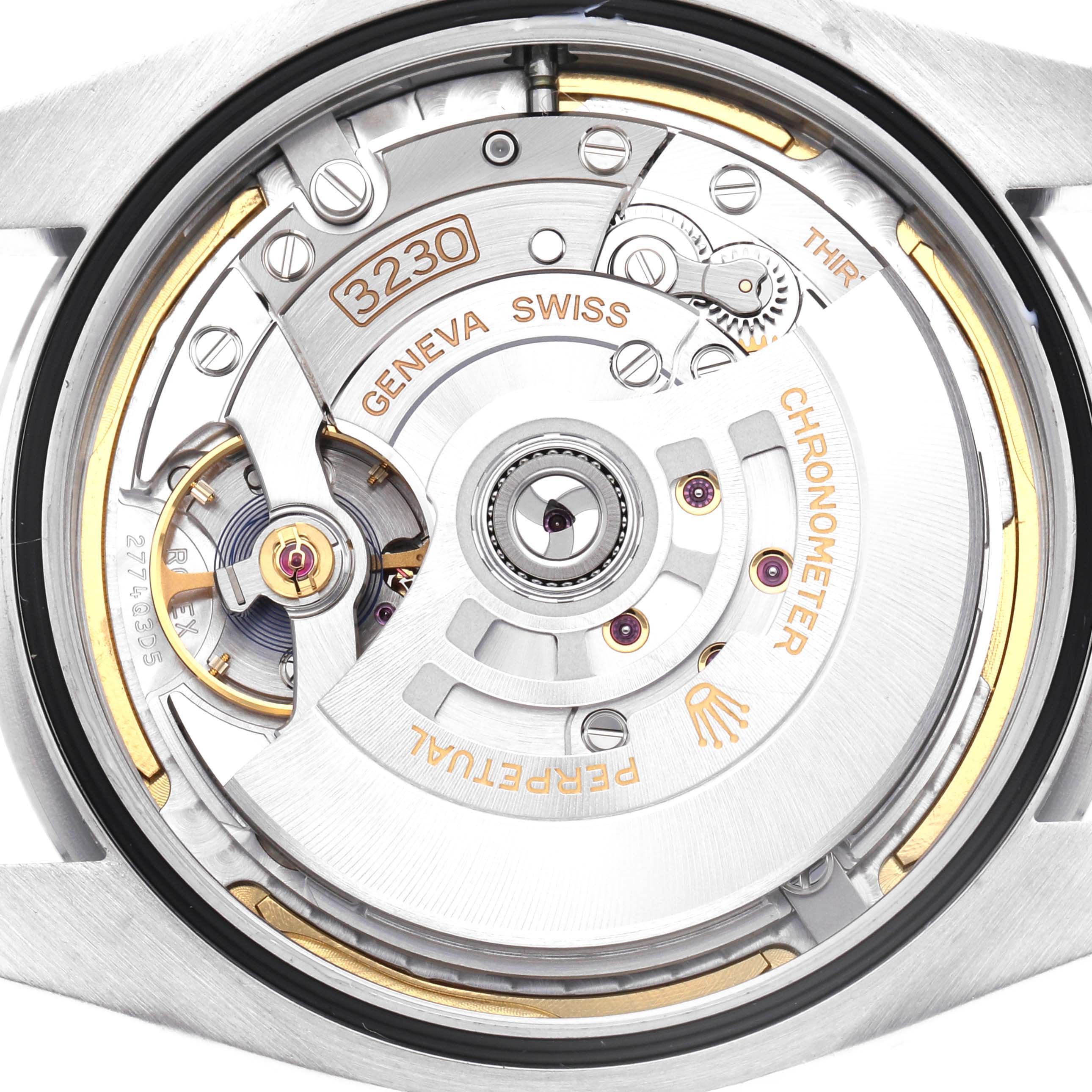 This image shows the movement of a Rolex Oyster Perpetual model 124300, showcasing the intricate details of its internal mechanics from a back view angle.