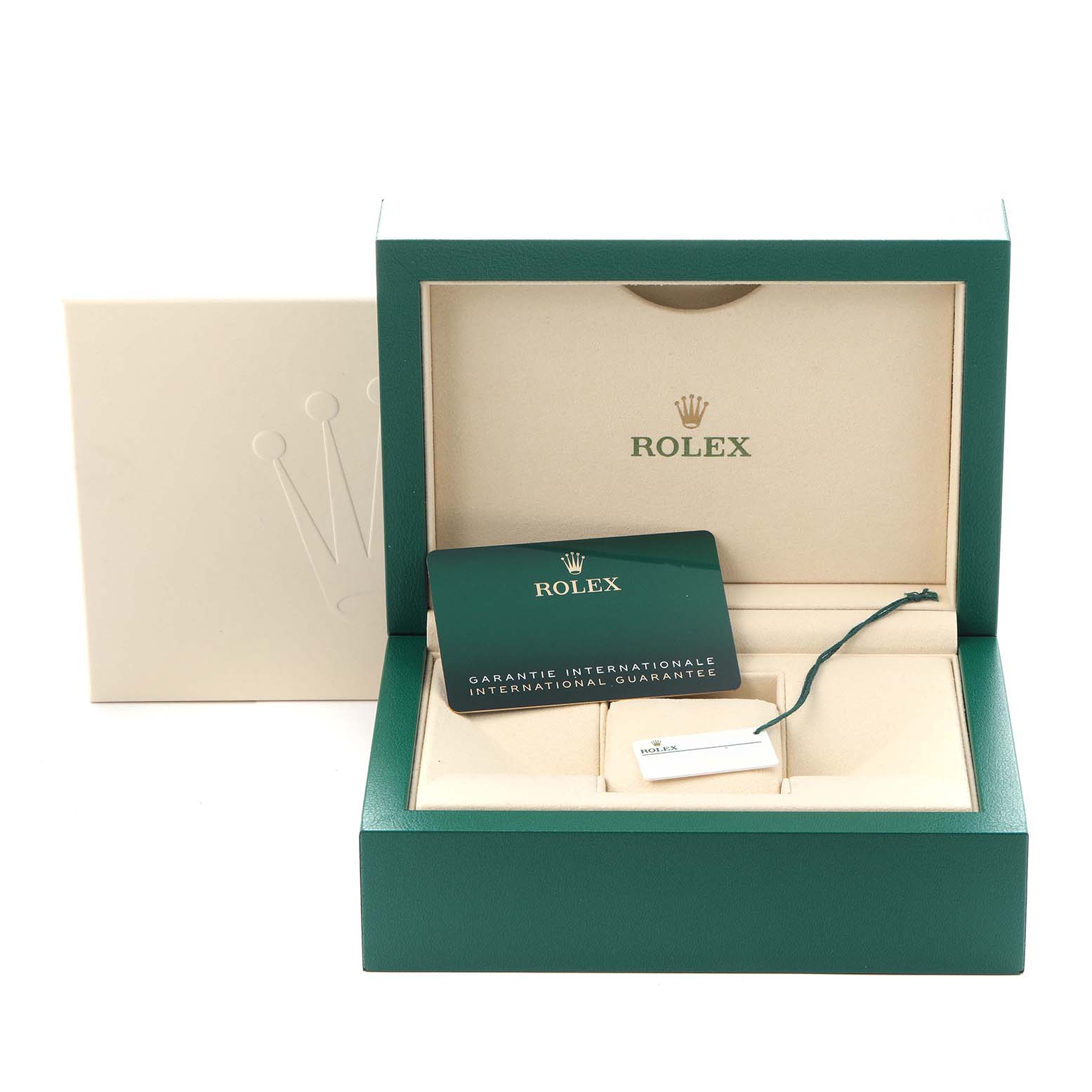 The image shows the open case of a Rolex Oyster Perpetual model 124300, including the international guarantee card and tag, with the box partially open.