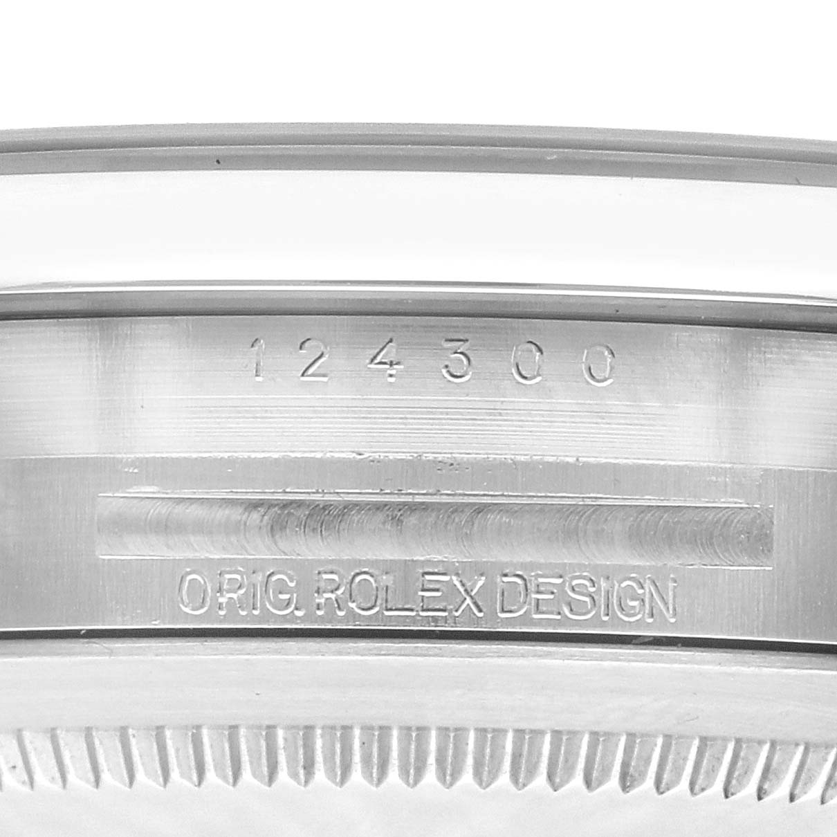 The image shows a close-up of the side of the Rolex Oyster Perpetual, model number 124300, displaying the engraved branding and model number.