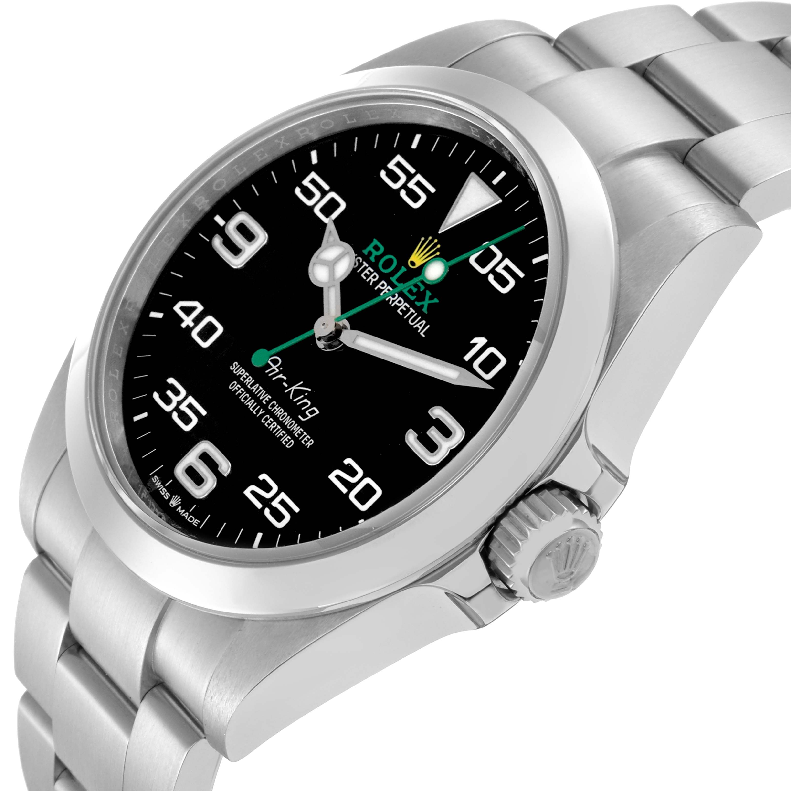 The Rolex Air-King model 126900 is shown at a slight angle, highlighting the face, bezel, crown, and part of the bracelet.