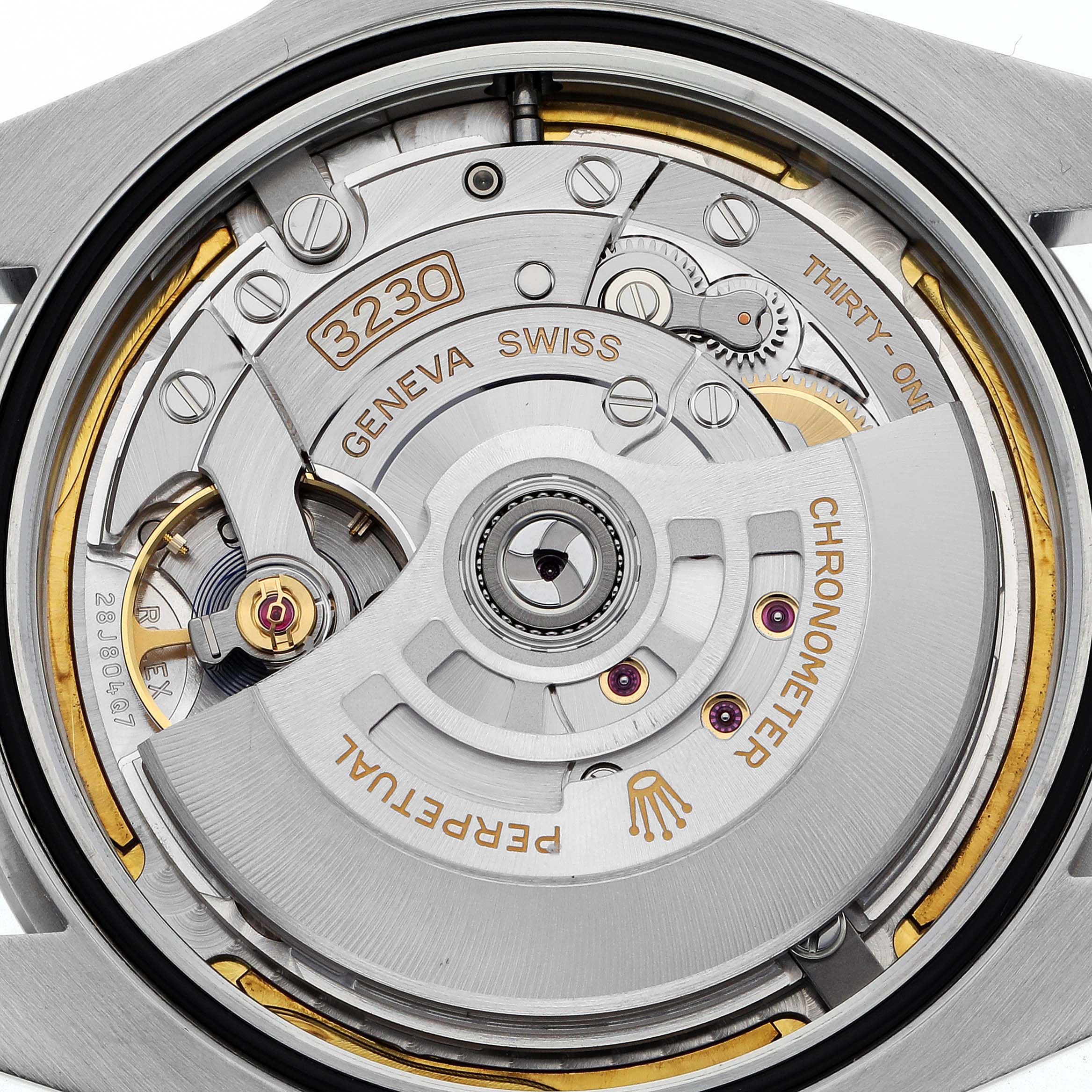 The image shows the movement of a Rolex Air-King model 126900 men's watch, highlighting the intricate mechanics and rotor from a back angle.