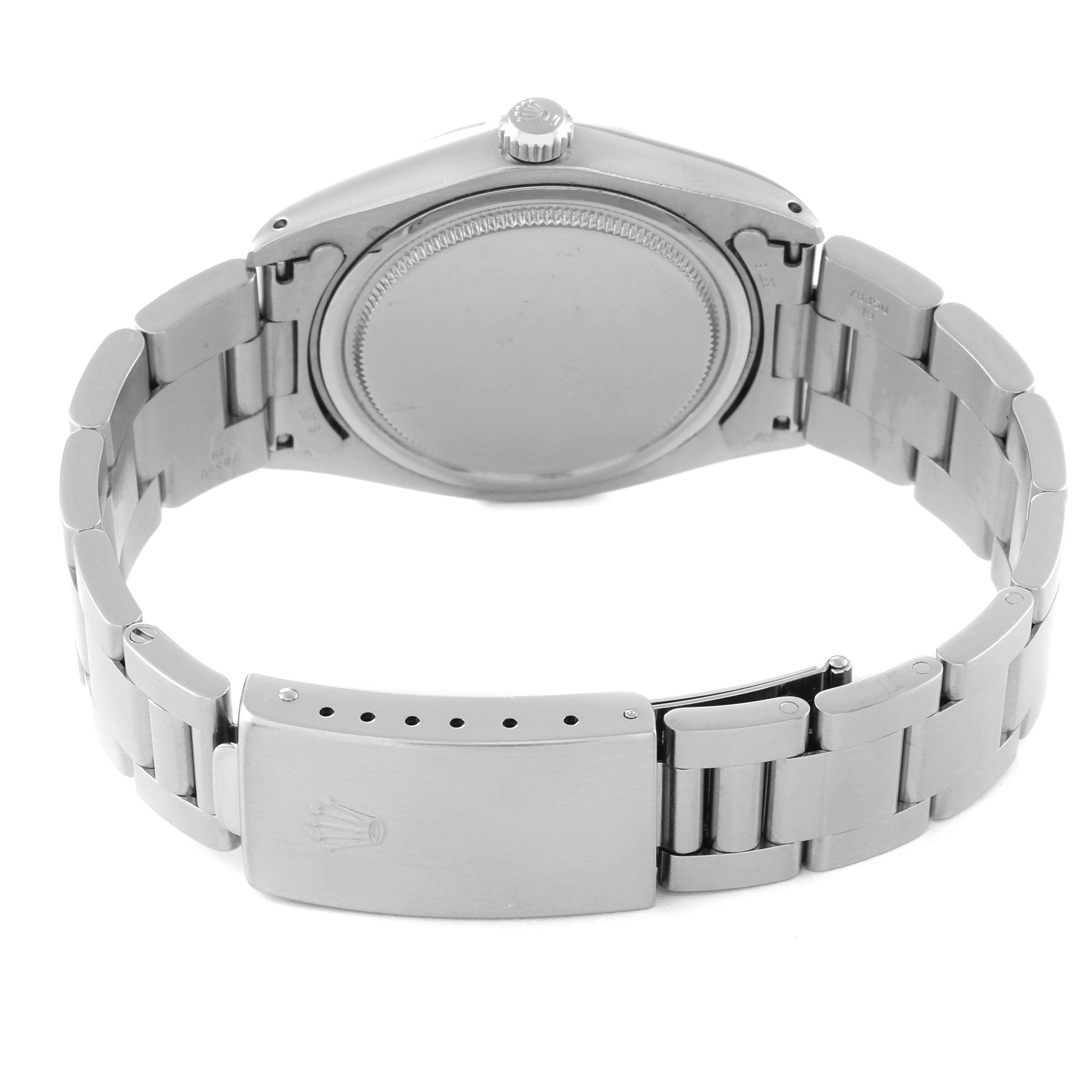 This image shows the backside of the Vintage Collection Rolex watch, focusing on the clasp and bracelet.