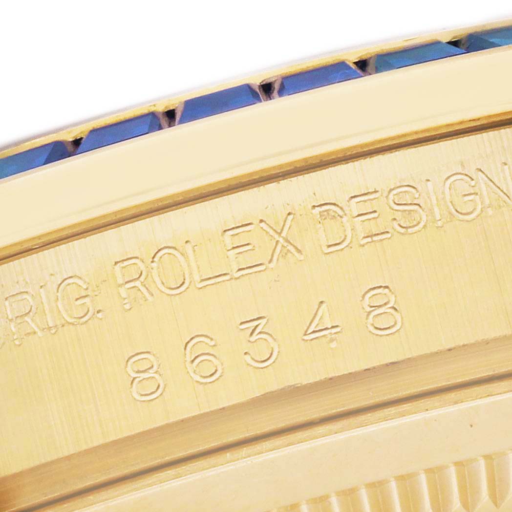 This close-up image shows the side of the bezel and serial number engraving on a Rolex Pearlmaster 86348 Men's Yellow Gold Green Dial 86348 Men's Yellow Gold Green Dial watch.