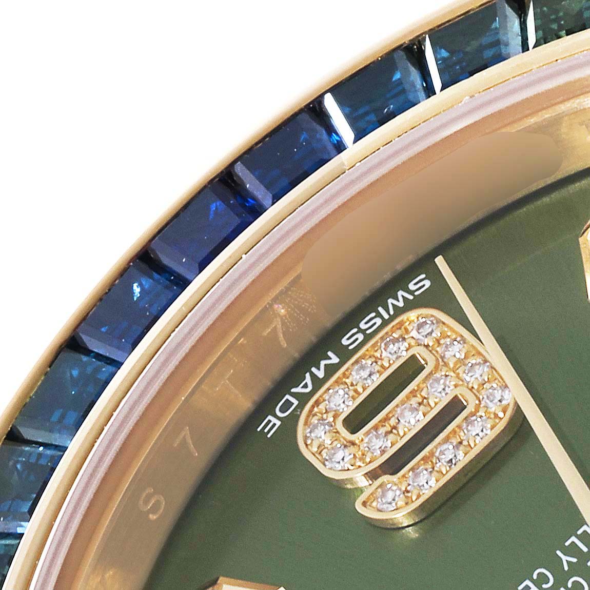 The image shows a close-up of the Rolex Pearlmaster 86348 Men's Yellow Gold Green Dial 86348 Men's Yellow Gold Green Dial watch, featuring part of the green dial, diamond-set numeral, and blue gemstone bezel.
