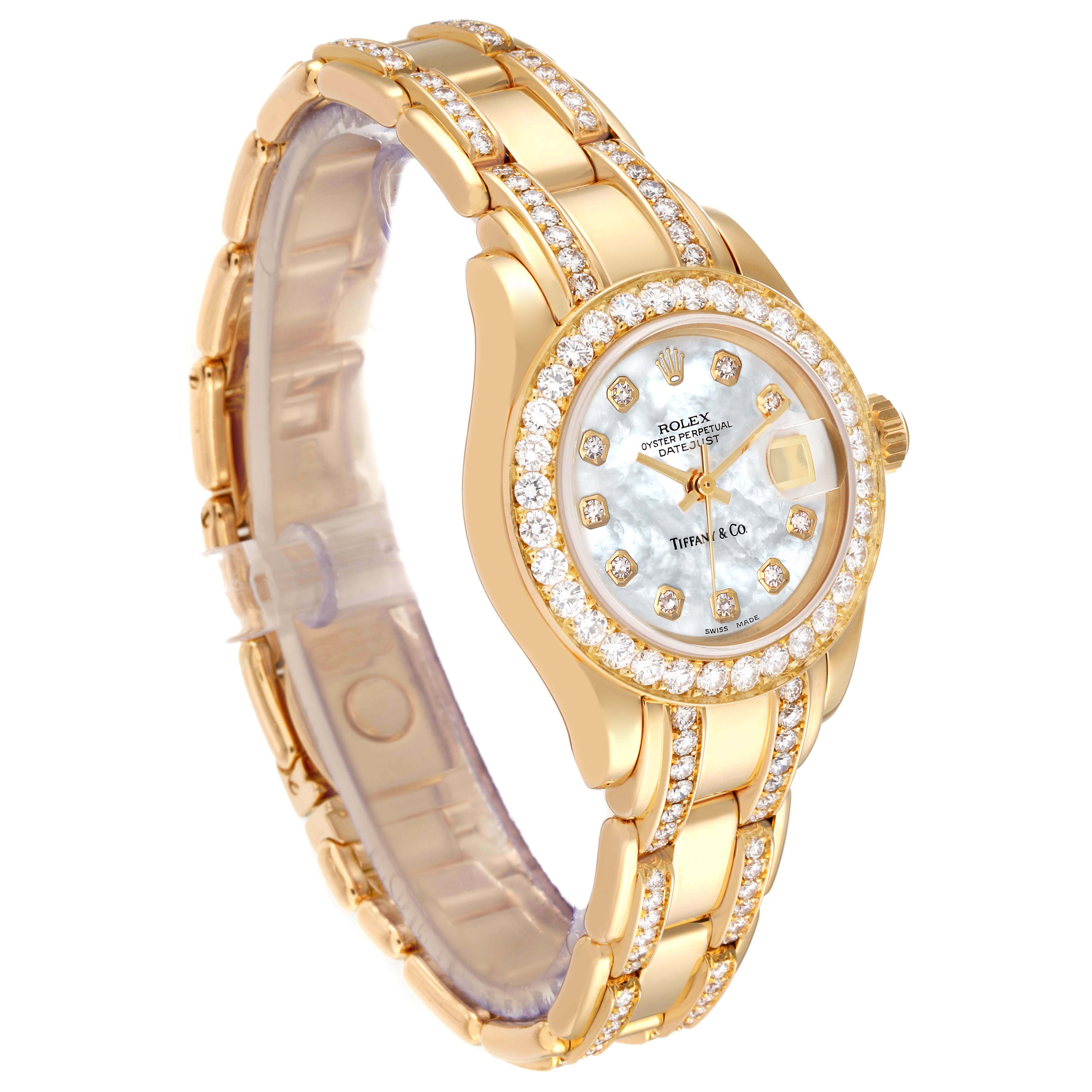 The image shows a Rolex Pearlmaster 69298 Women's Yellow Gold Mother of Pearl Dial 69298 Women's Yellow Gold Mother of Pearl Dial watch angled to display its face, band, and bejeweled accents.