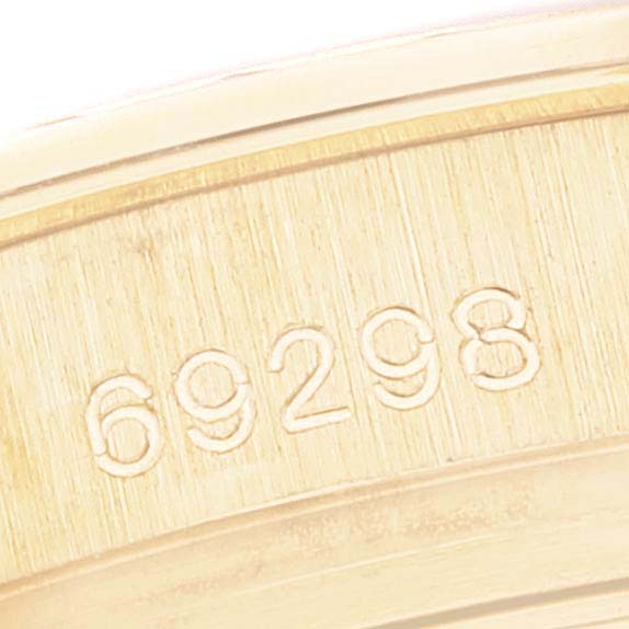 This image shows a close-up view of the model number 69298 engraved on the case back of a Rolex Pearlmaster 69298 Women's Yellow Gold Mother of Pearl Dial 69298 Women's Yellow Gold Mother of Pearl Dial watch.