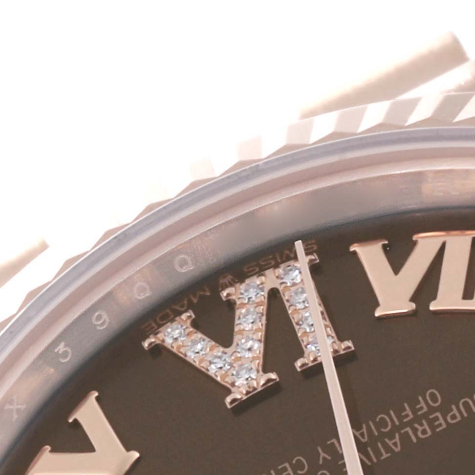 This close-up angle showcases the Rolex President 278275 Women's Rose Gold Brown Dial 278275 Women's Rose Gold Brown Dial watch's Roman numeral hour markers and part of its bezel.