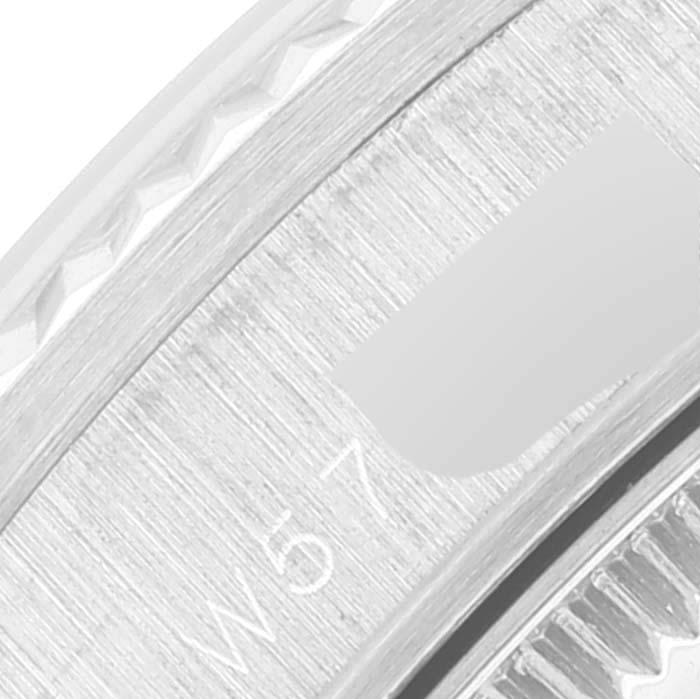 This close-up image shows a detailed view of the inner edge of a Rolex President 68279 Women's Stainless Steel Silver Dial 68279 Women's Stainless Steel Silver Dial watch bezel and part of the engraved serial number.