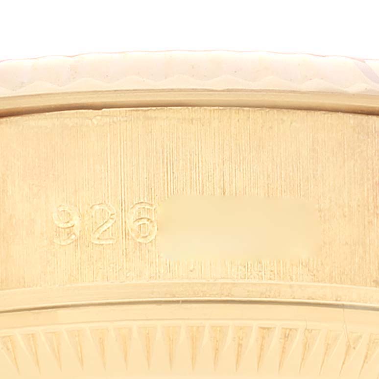 This close-up shot shows the side of the case of a Rolex President 69178 Women
s Yellow Gold Champagne Dial 69178 Women
s Yellow Gold Champagne Dial model, highlighting its engraving details.