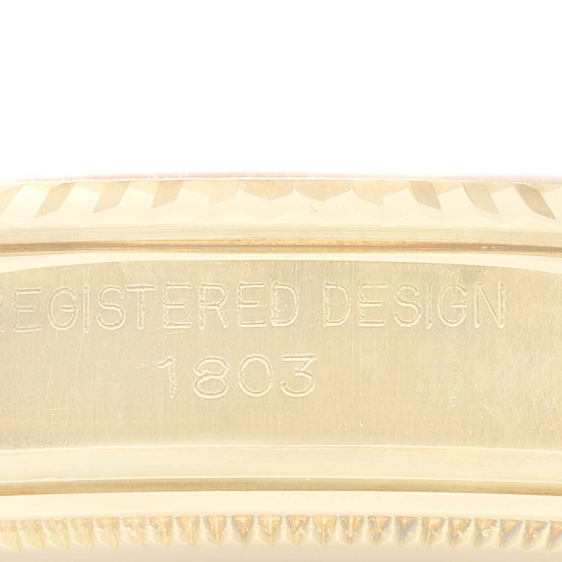 This image shows an engraved side view of a Rolex Vintage Collection 1803 Men's Yellow Gold Champagne Dial 1803 Men's Yellow Gold Champagne Dial model 1803 with the words "REGISTERED DESIGN."