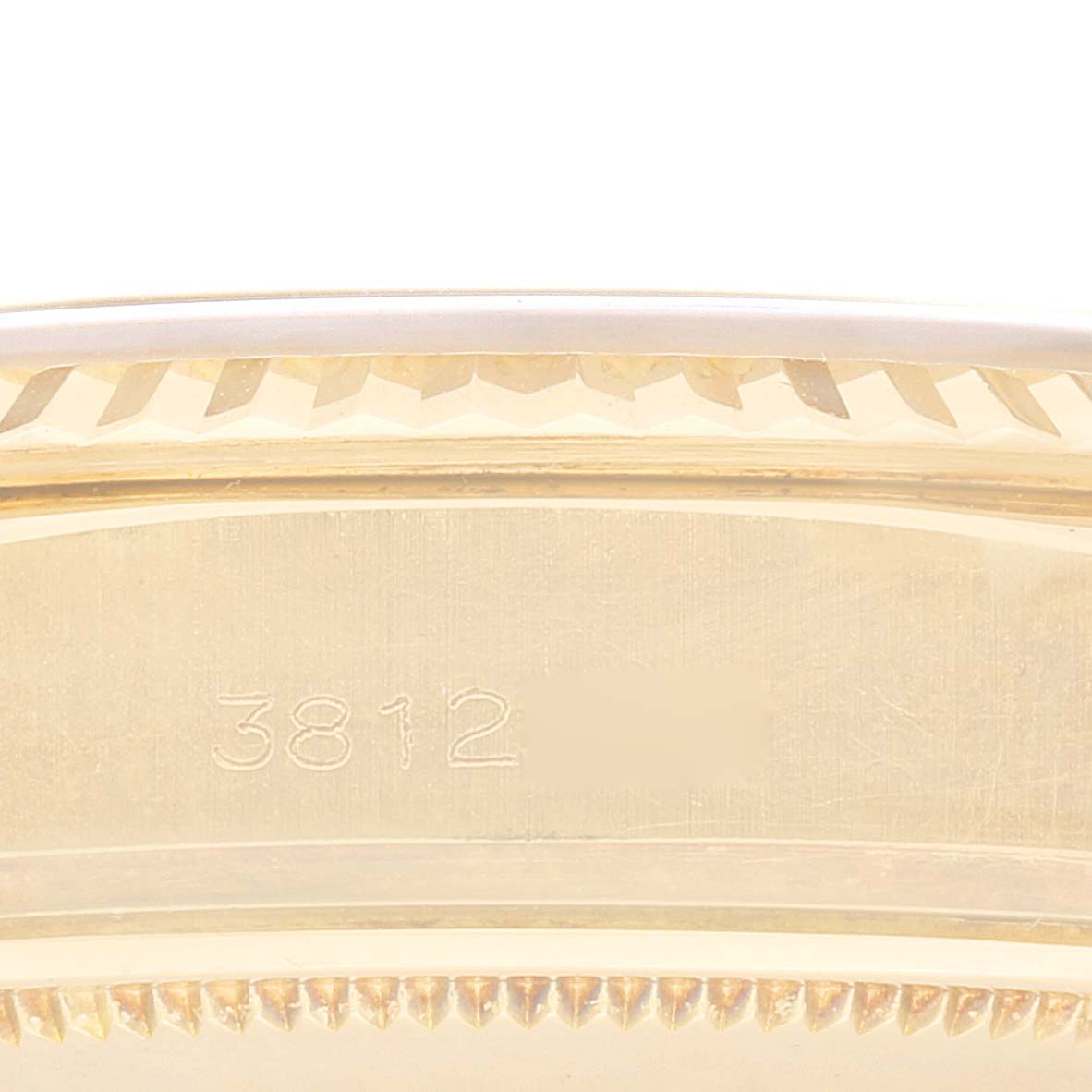 This image shows the side profile of the case of a Vintage Collection Rolex watch, focusing on the engraved serial number "3812."