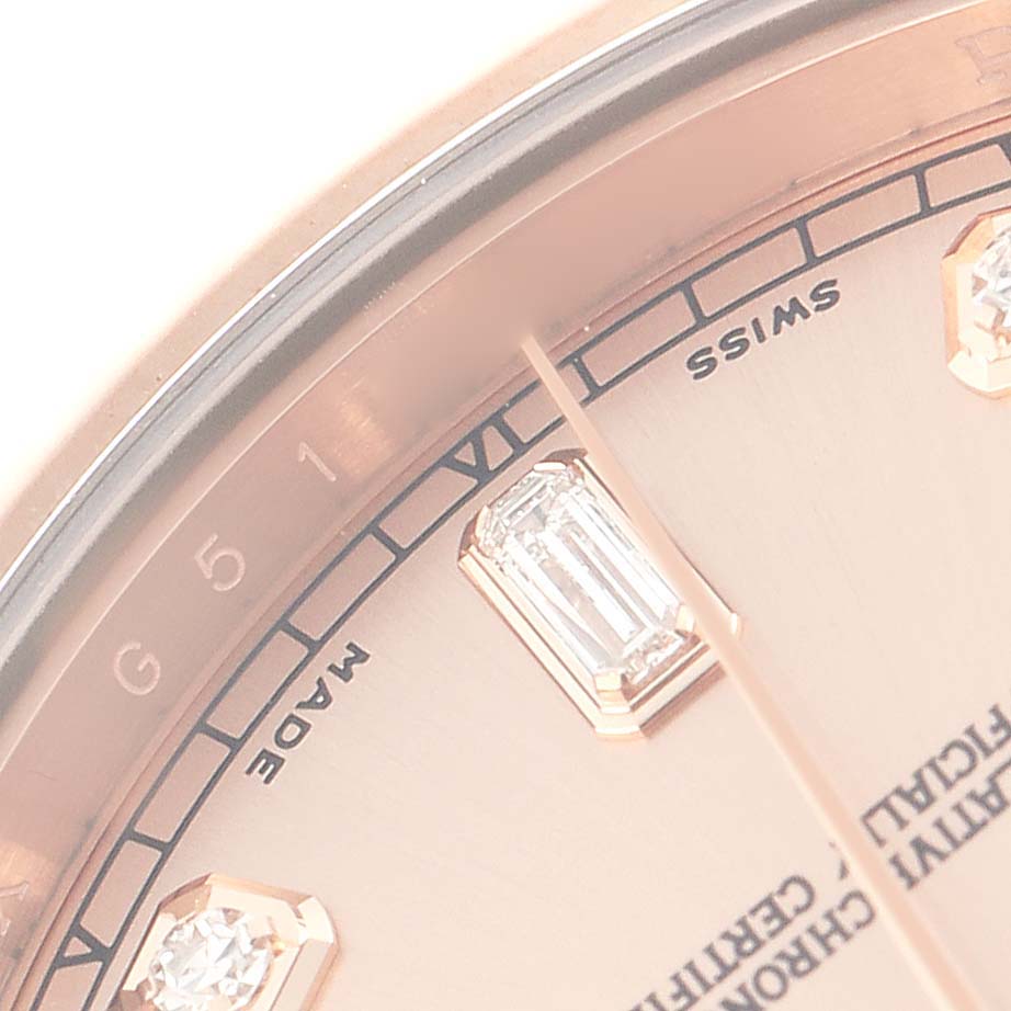 The image shows a close-up of the Rolex President model 218235, highlighting the edge of the dial with diamond hour markers and partial text.