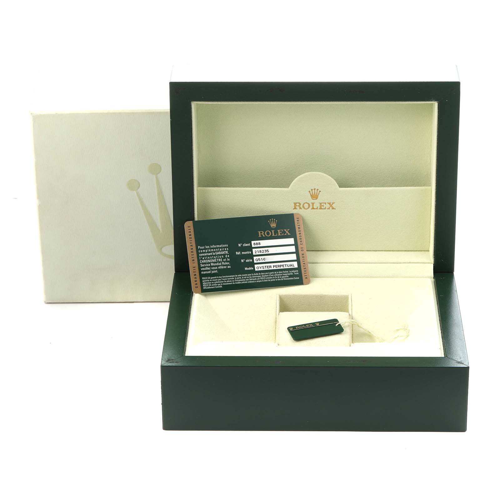 The image shows an open Rolex box for the President model, model number 218235, with a card and tag inside, photographed from the front.
