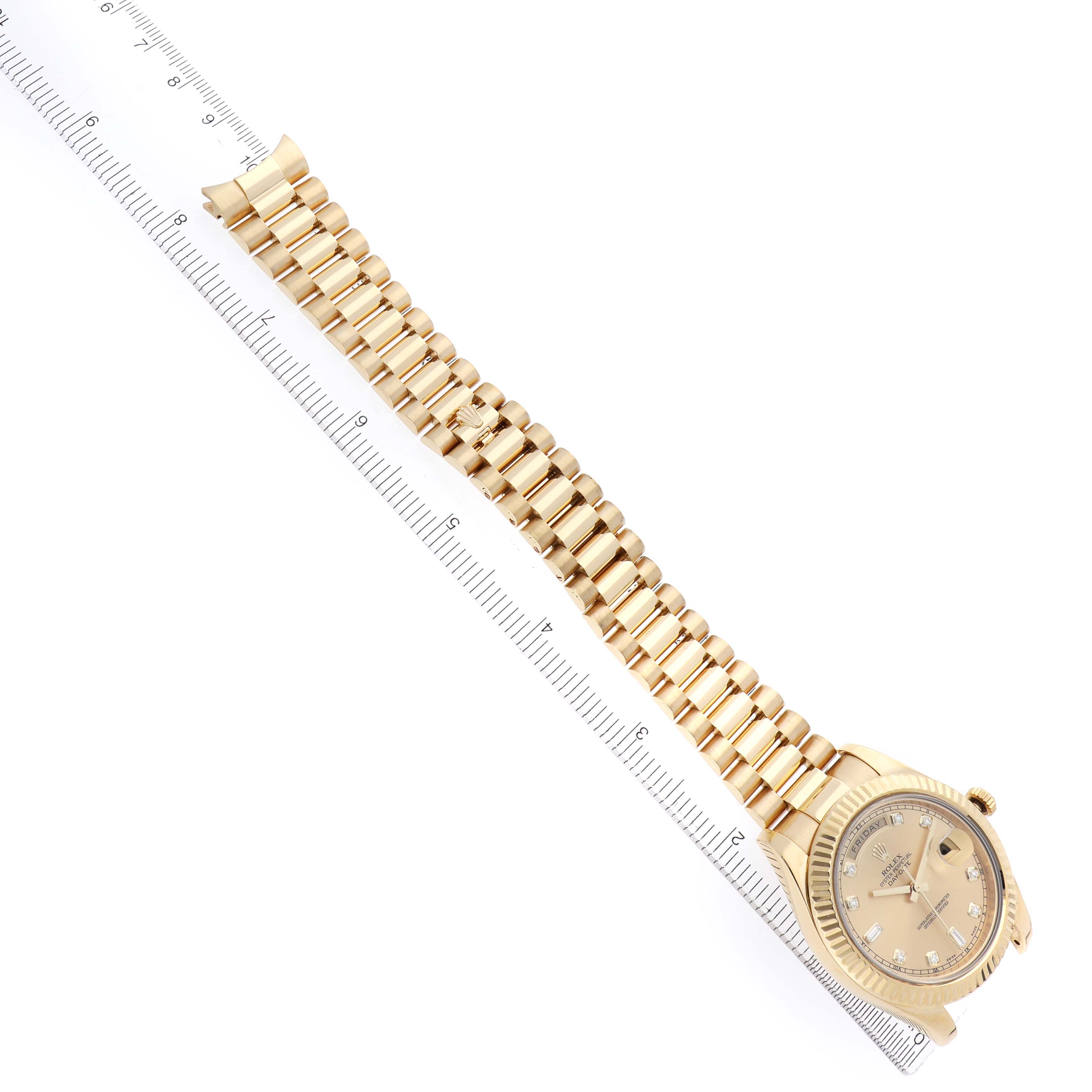 The image shows a Rolex President model 218238 men
s watch from an angled top-down perspective, highlighting the face, bracelet, and partial ruler for scale.