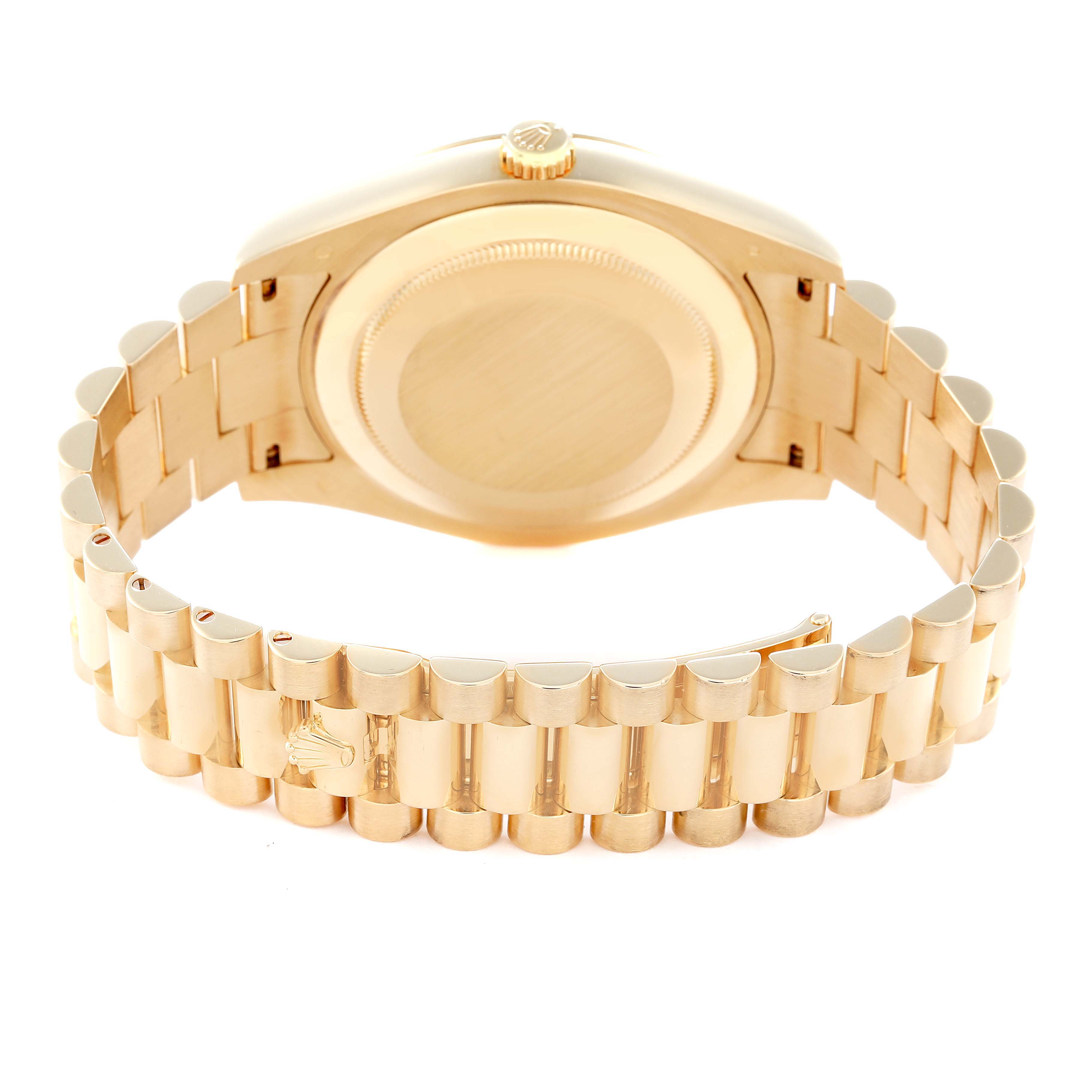 The image shows the back view of the Rolex President model number 218238, highlighting the case back and the gold bracelet with polished links.