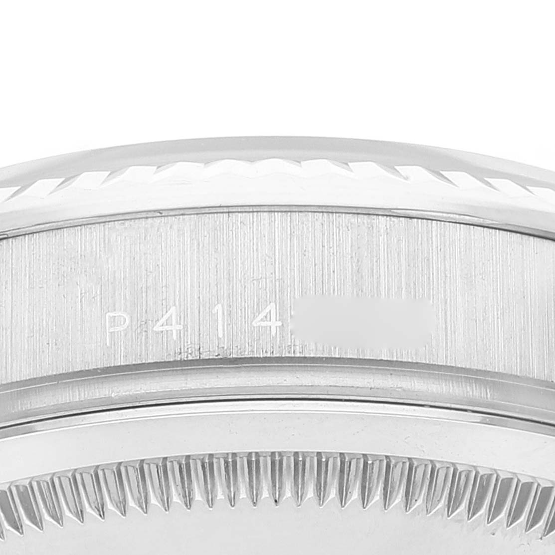 The image shows a close-up of the side of the case and bezel of a Rolex President 118239 Men's Stainless Steel Silver Dial 118239 Men's Stainless Steel Silver Dial watch model, emphasizing the engraved serial number.