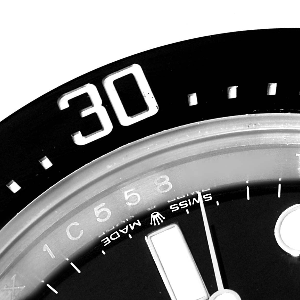 The image shows a close-up of the bezel and part of the dial of a Rolex Sea-Dweller 126600 Men
s Stainless Steel Black Dial 126600 Men
s Stainless Steel Black Dial watch, highlighting the 30-minute mark and Swiss Made text.