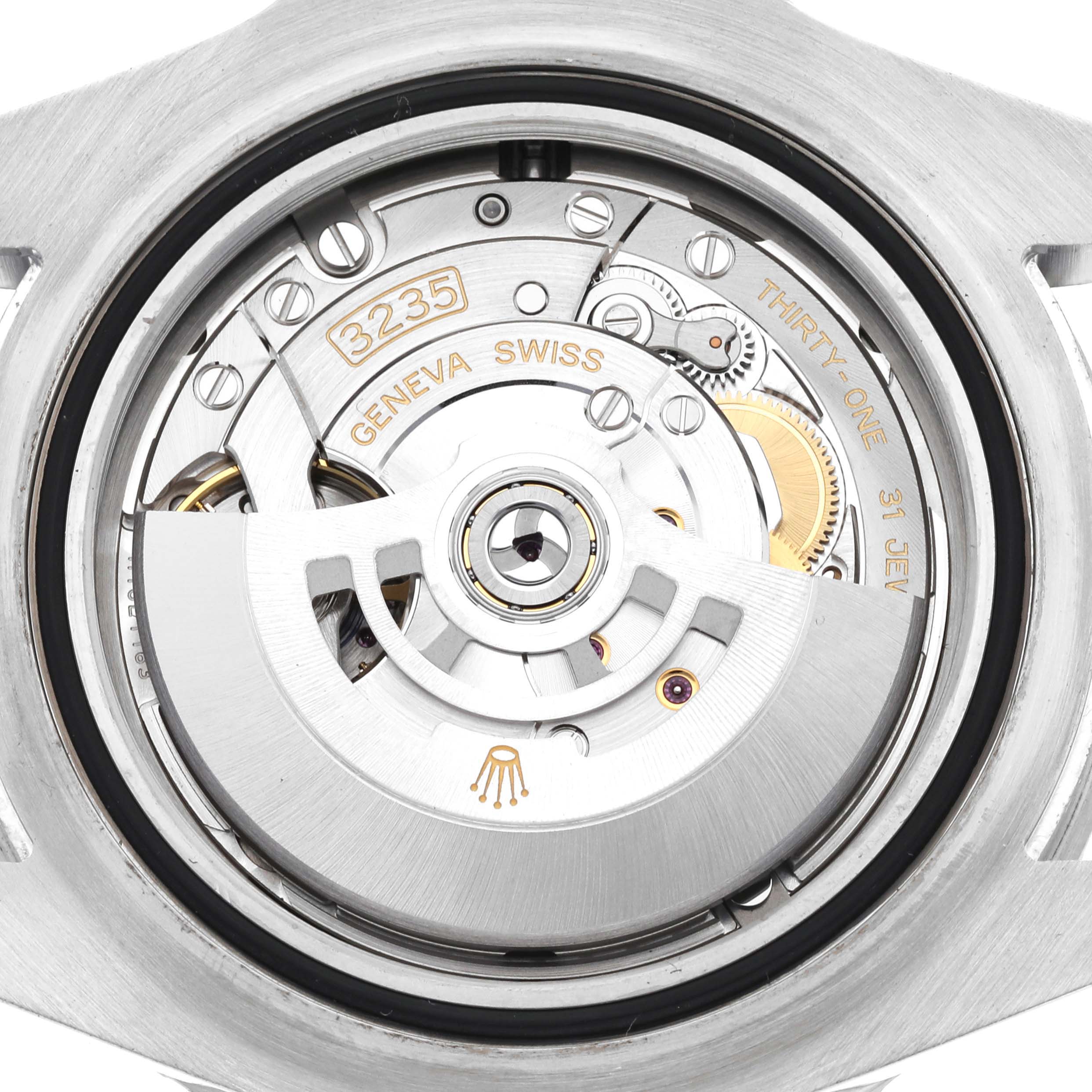 The image shows the interior mechanical movement of a Rolex Sea-Dweller 126600 Men
s Stainless Steel Black Dial 126600 Men
s Stainless Steel Black Dial watch, featuring the rotor and various gears.