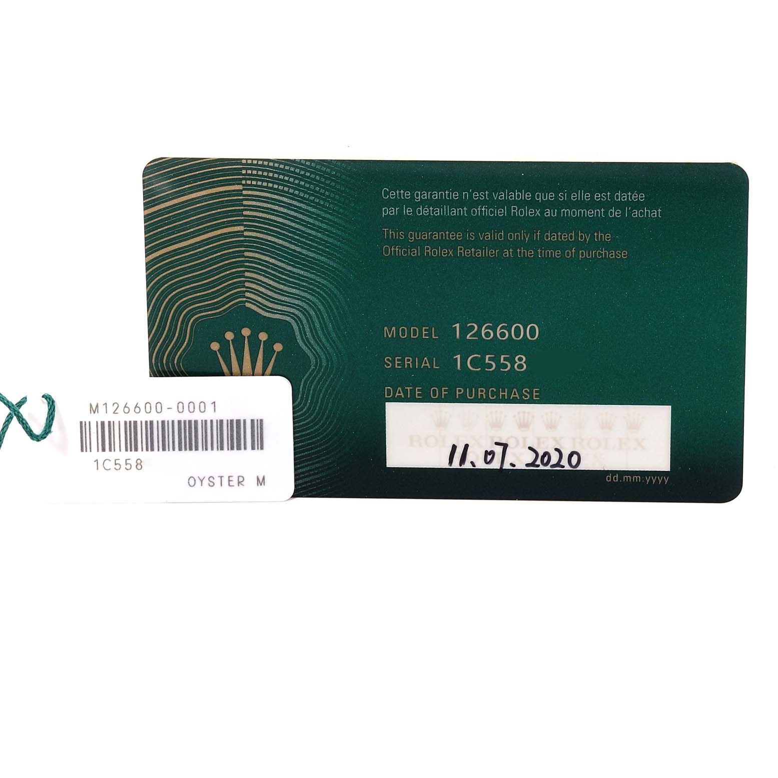 The image shows a warranty card and tag for a Rolex Sea-Dweller 126600 Men
s Stainless Steel Black Dial 126600 Men
s Stainless Steel Black Dial model 126600 watch.