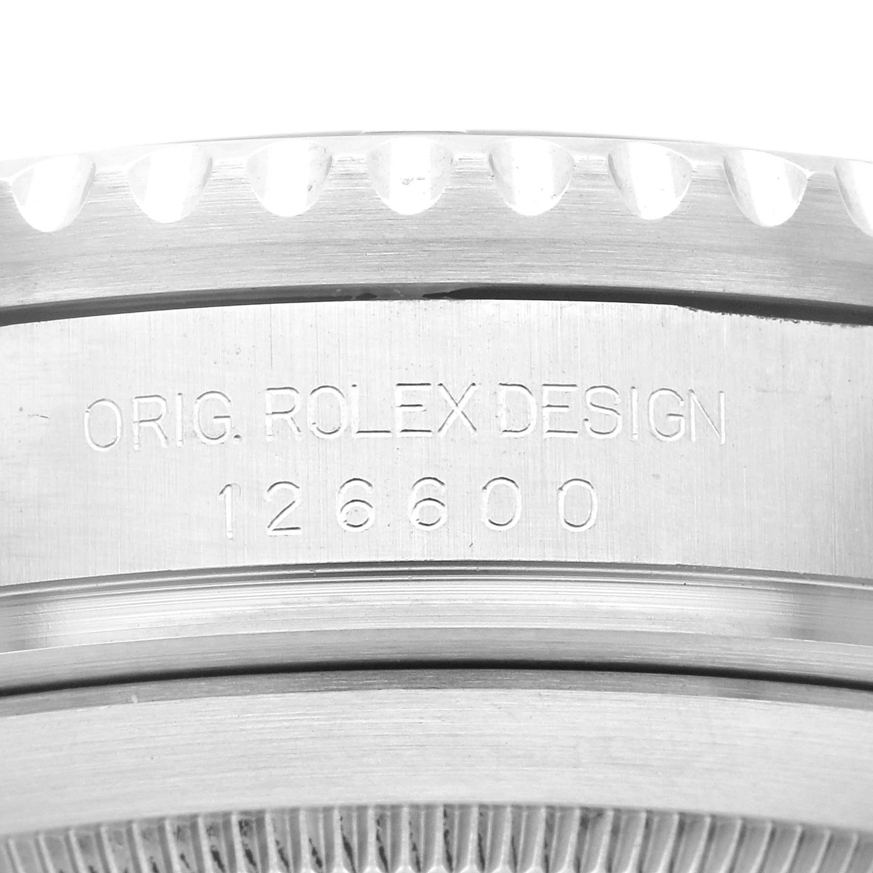This image shows a close-up of the edge of the bezel and case side of a Rolex Sea-Dweller 126600 Men
s Stainless Steel Black Dial 126600 Men
s Stainless Steel Black Dial 126600, etched with "ORIG. ROLEX DESIGN."