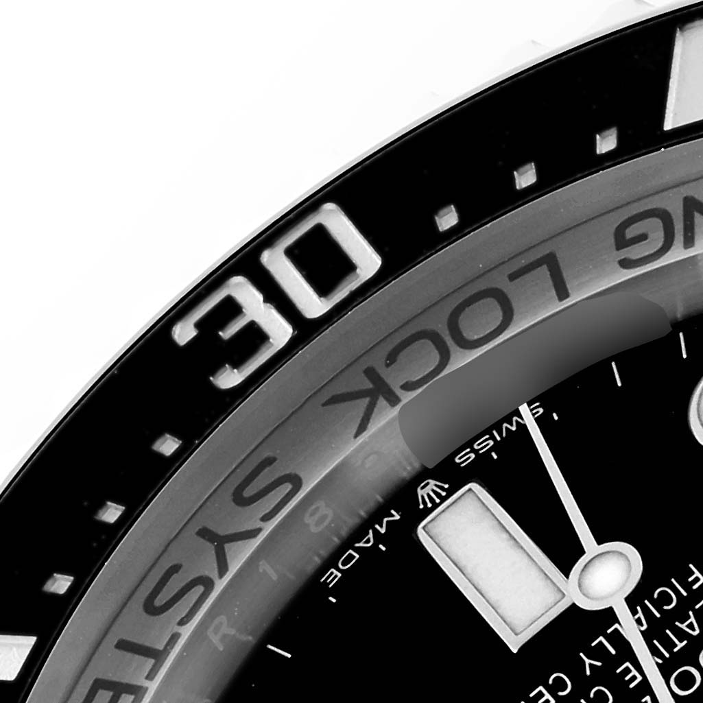 This close-up image of a Rolex Sea-Dweller 136660 Men
s Stainless Steel Black Dial 136660 Men
s Stainless Steel Black Dial watch shows the bezel and part of the dial, highlighting the "30" marker.