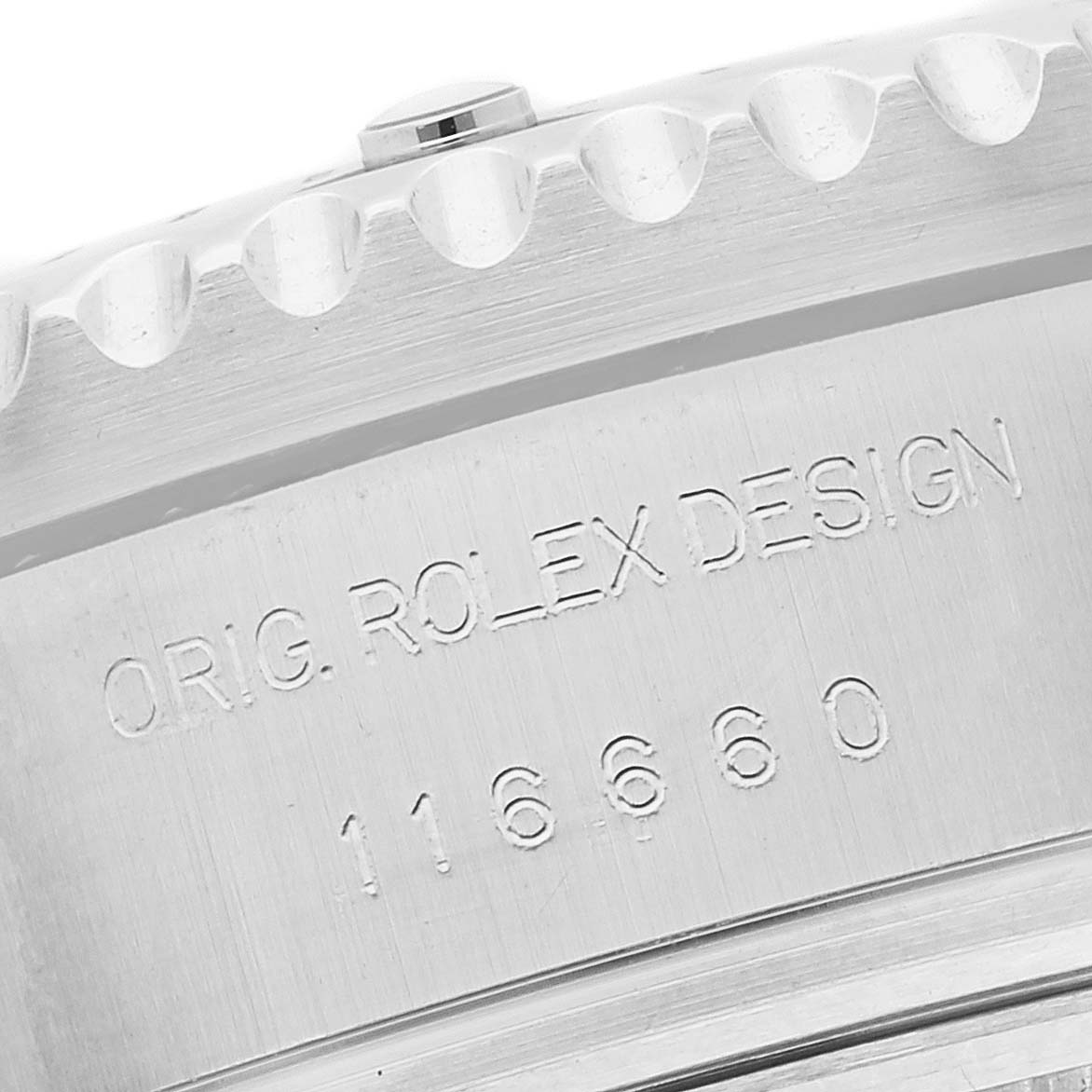 This image shows a close-up of the engraved case back of a Rolex Sea-Dweller 116660 Men
s Stainless Steel Black Dial 116660 Men
s Stainless Steel Black Dial model 116660, displaying "Orig. Rolex Design."