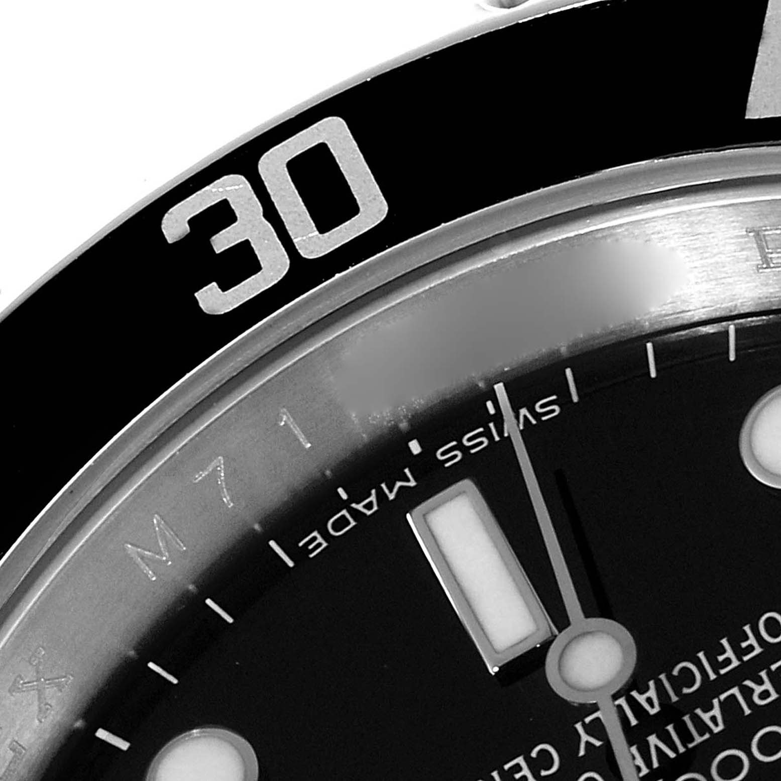 This close-up image of the Rolex Submariner 16610 Men
s Stainless Steel Black Dial 16610 Men
s Stainless Steel Black Dial shows the bezel with the 30-minute marker and part of the dial with the "Swiss Made" text.