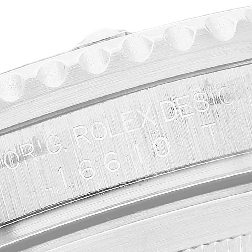 This close-up angle shows the engraved caseback of a Rolex Submariner 16610 Men
s Stainless Steel Black Dial 16610 Men
s Stainless Steel Black Dial watch, displaying the model number 16610.