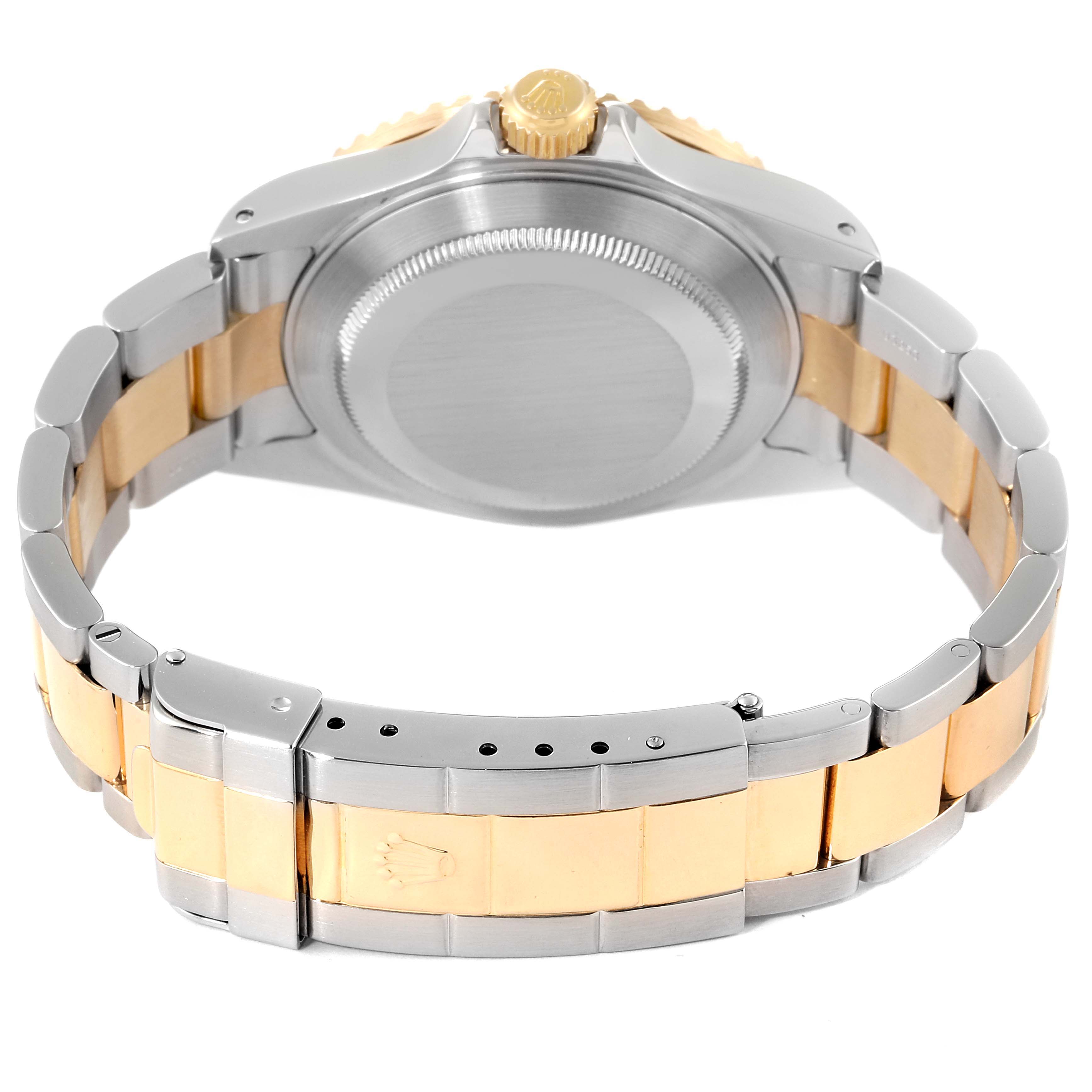 The image shows the back case and bracelet of a Rolex Submariner 16613 Men's Steel and Gold (two tone) Blue Dial 16613 Men's Steel and Gold (two tone) Blue Dial watch, highlighting its two-tone design.