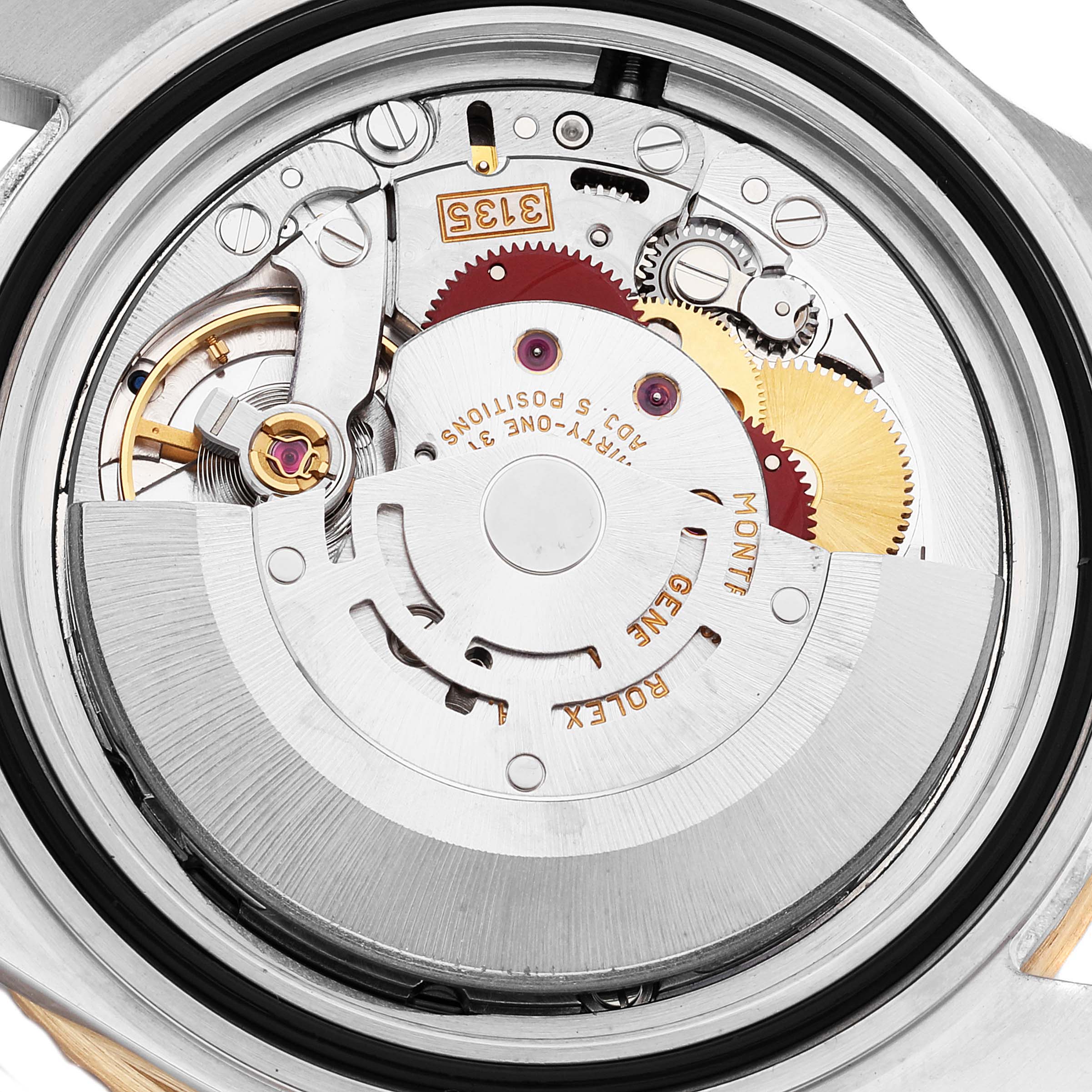 This image shows the internal mechanical parts of a Rolex Submariner 16613 Men's Steel and Gold (two tone) Blue Dial 16613 Men's Steel and Gold (two tone) Blue Dial watch, featuring gears and components of its movement.