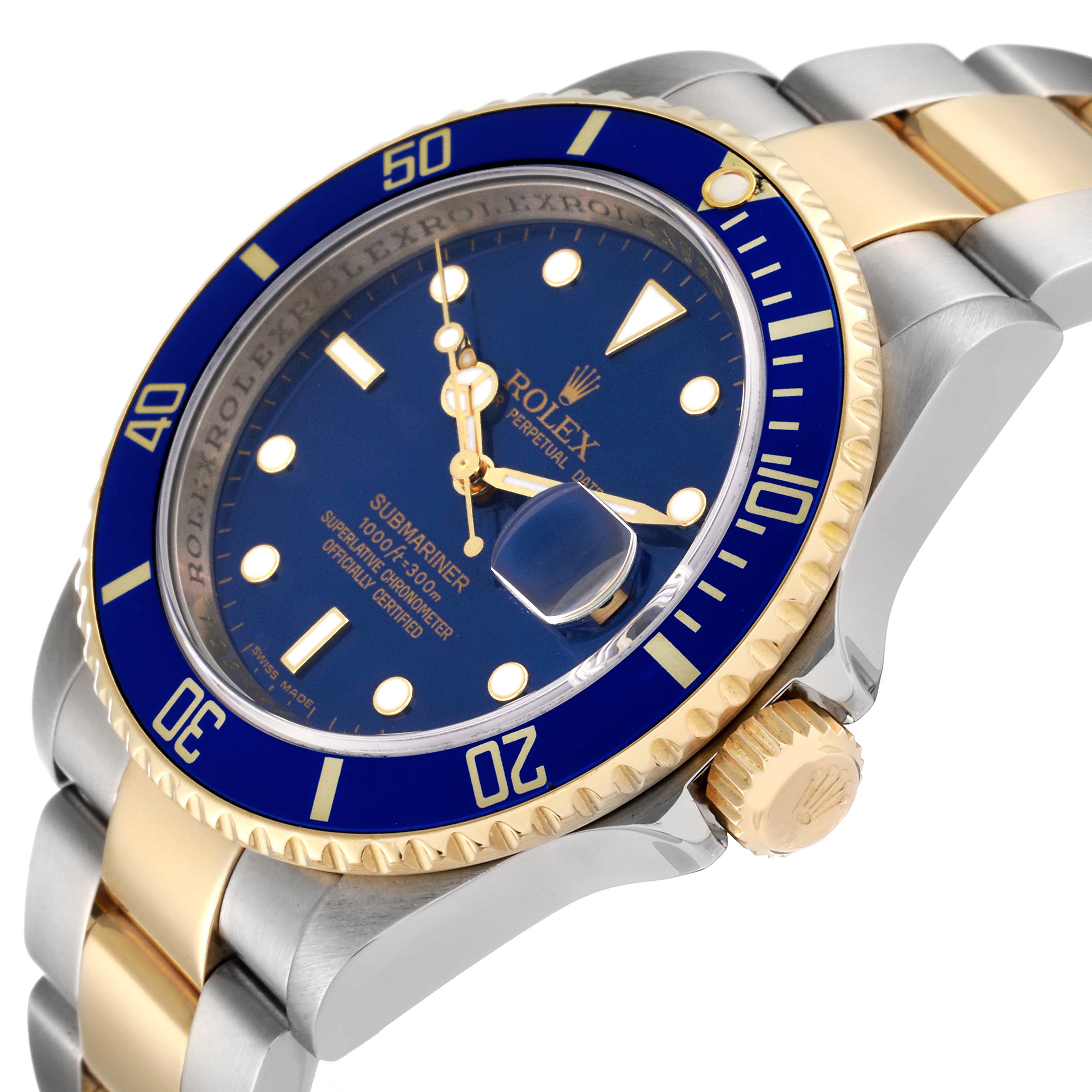 The image shows a close-up angle of the Rolex Submariner 16613 Men
s Steel and Gold (two tone) Blue Dial 16613 Men
s Steel and Gold (two tone) Blue Dial watch, highlighting its blue and gold bezel, face, and crown.