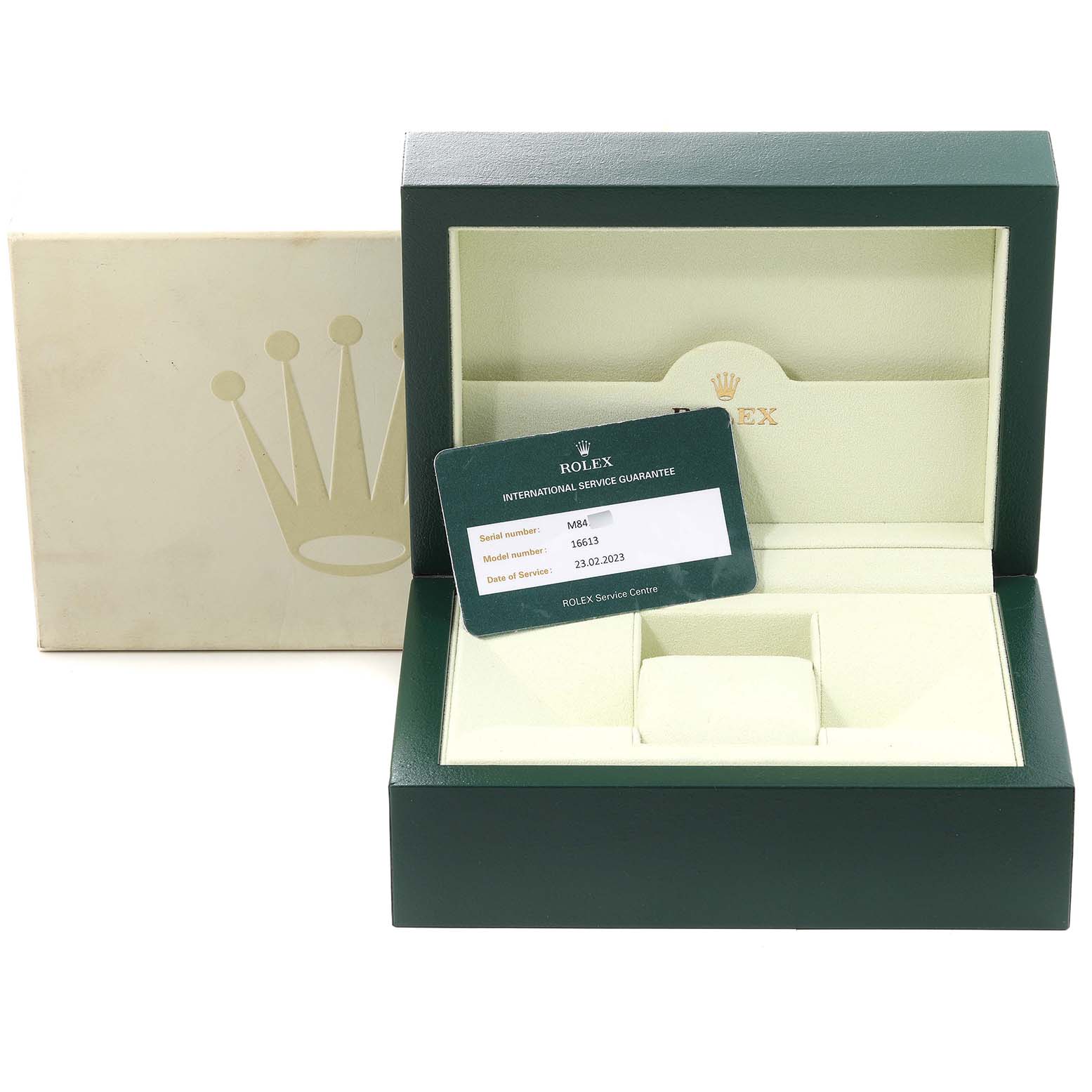 This image shows an open Rolex Submariner 16613 Men
s Steel and Gold (two tone) Blue Dial 16613 Men
s Steel and Gold (two tone) Blue Dial watch box with a service guarantee card displayed inside.