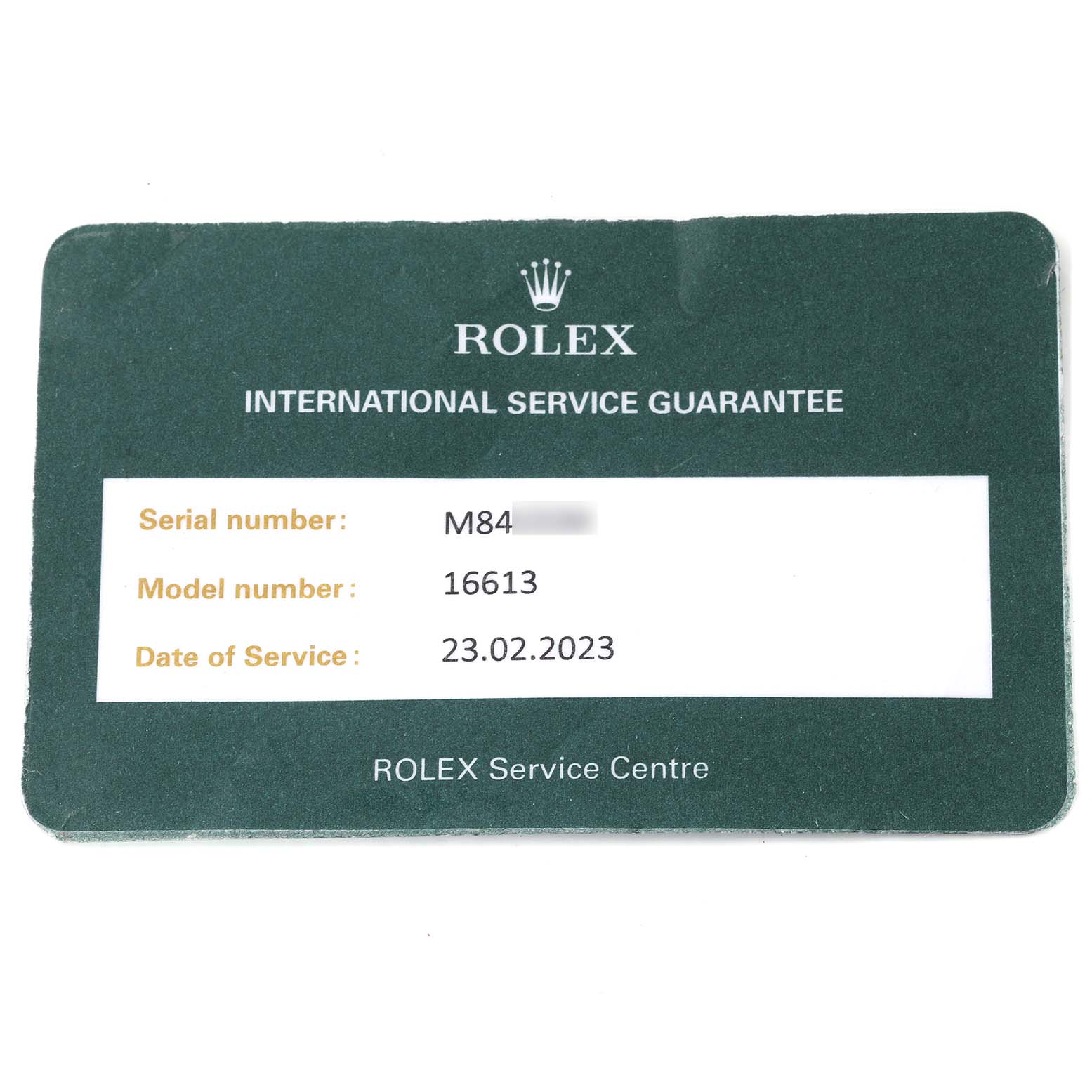 This image shows a Rolex International Service Guarantee card for the Rolex Submariner 16613 Men
s Steel and Gold (two tone) Blue Dial 16613 Men
s Steel and Gold (two tone) Blue Dial model 16613.