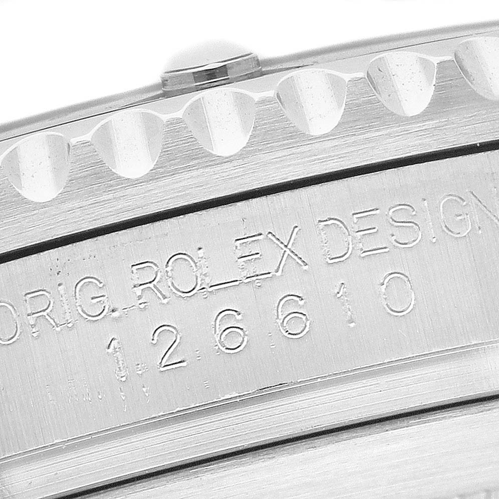 The image shows a close-up of the Rolex Submariner 126610LN Men's Stainless Steel Black Dial's engraved case and bezel edge.