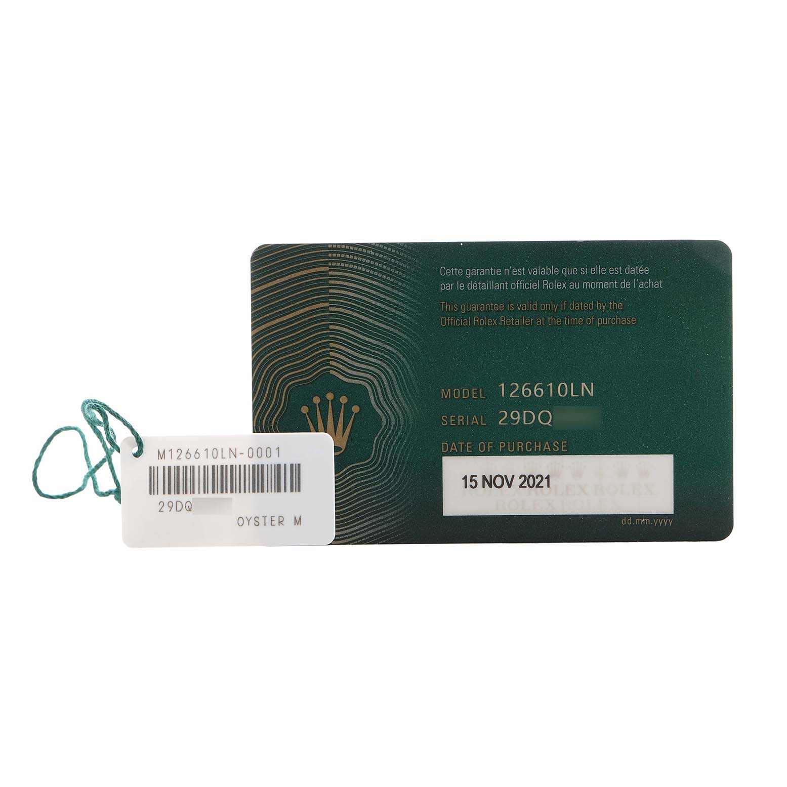 The image shows a green Rolex Submariner 126610LN Men's Stainless Steel Black Dial model warranty card and a tag with reference and serial numbers.