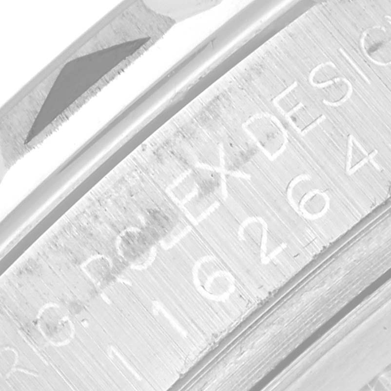 This image shows a close-up of the engraved bezel and casing of a Rolex Turn-o-Graph 116264 Men
s Stainless Steel White Dial 116264 Men
s Stainless Steel White Dial watch model.