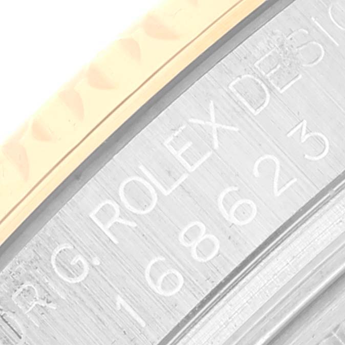 The image shows a close-up of the engraved case back of the Rolex Yacht-Master 168623 Men
s Steel and Gold (two tone) Champagne Dial 168623 Men
s Steel and Gold (two tone) Champagne Dial watch, displaying the model number.