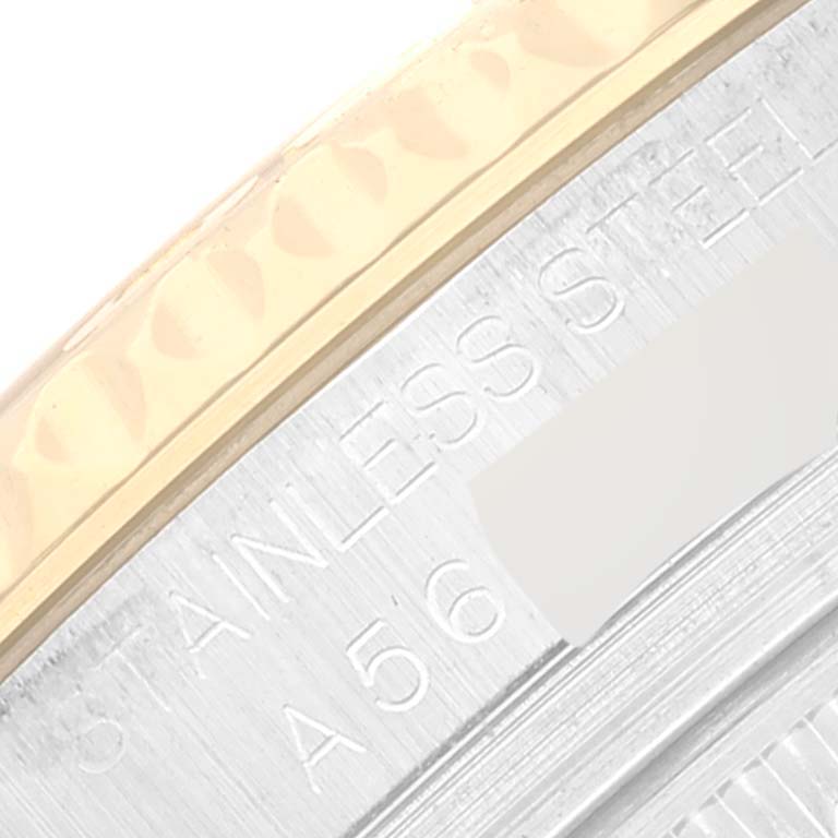This image shows a close-up of the bezel and engraved "Stainless Steel" marking on a Rolex Yacht-Master 168623 Men
s Steel and Gold (two tone) Champagne Dial 168623 Men
s Steel and Gold (two tone) Champagne Dial watch.