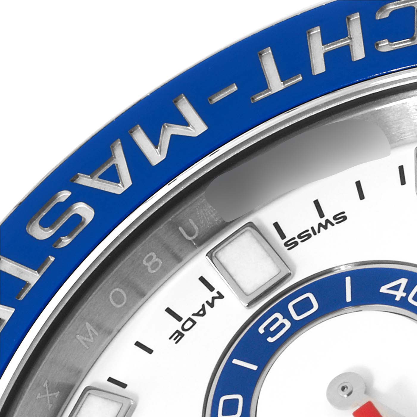 This close-up angle of the Rolex Yacht-Master 116680 Men
s Stainless Steel White Dial 116680 Men
s Stainless Steel White Dial watch shows the bezel, part of the dial with markers, and the word "MADE."