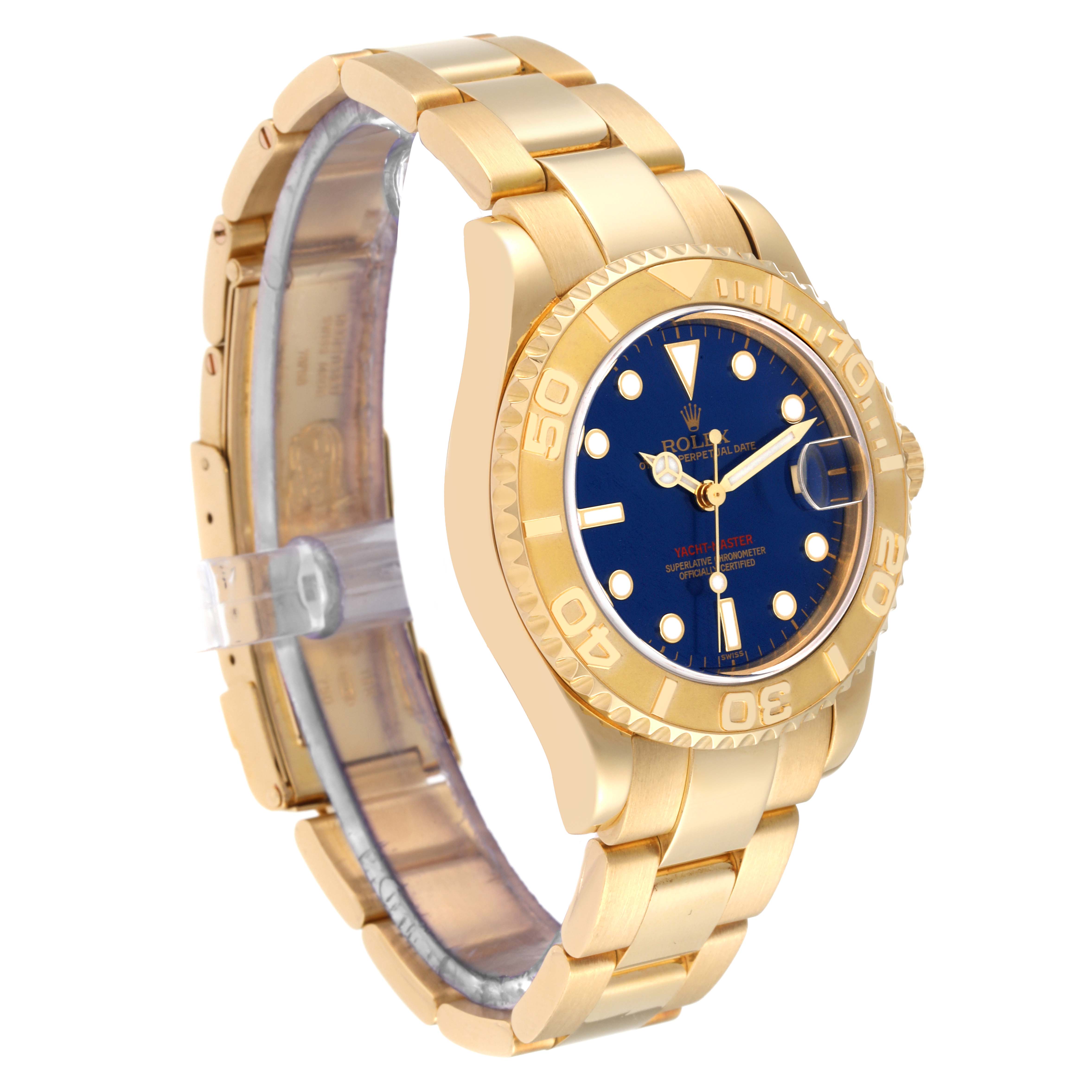The image shows a side angle of a Rolex Yacht-Master 68628 Men's Yellow Gold Blue Dial 68628 Men's Yellow Gold Blue Dial watch, highlighting the gold bracelet, bezel, and blue dial.