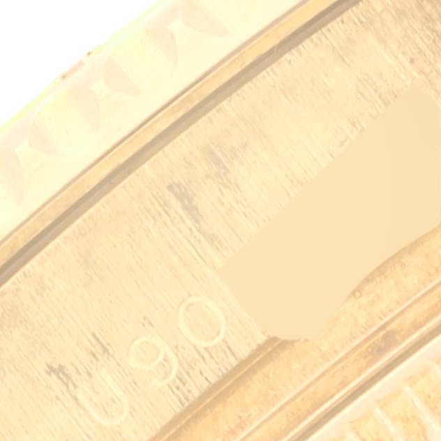 This image shows a close-up of the side of the Rolex Yacht-Master 68628 Men's Yellow Gold Blue Dial 68628 Men's Yellow Gold Blue Dial watch, highlighting part of the bezel and brushed metal finish.