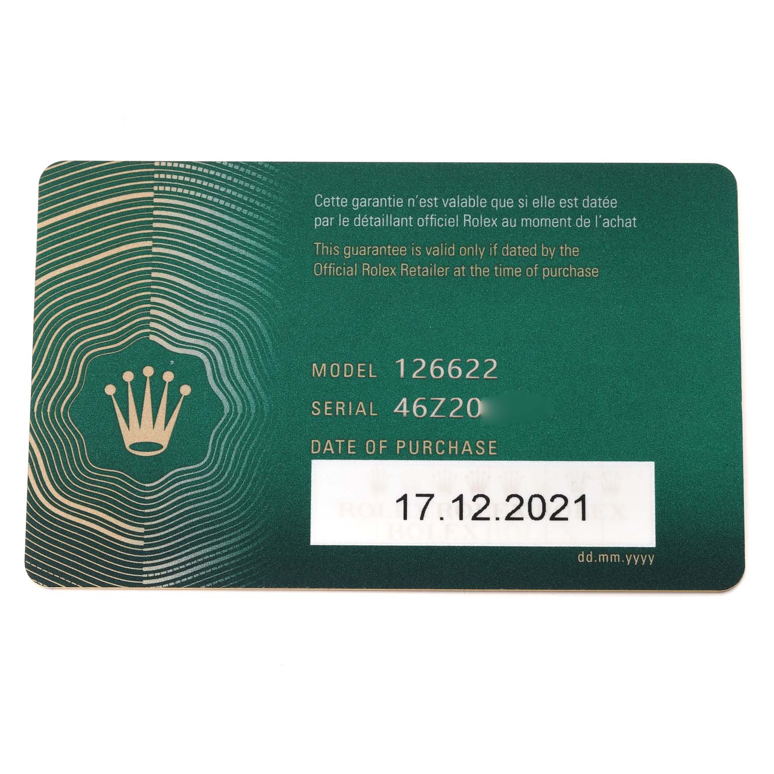 This image shows a green Rolex guarantee card for the Yacht-Master model with the purchase date, serial number, and model number.