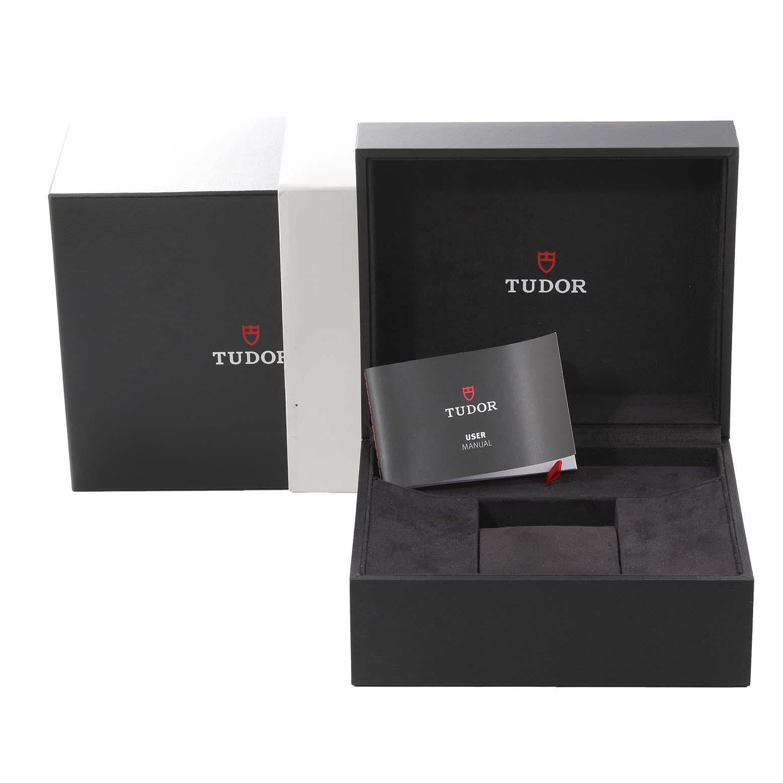 The image shows the open box and user manual for the Tudor Heritage Black Bay 79220 Men
s Stainless Steel Black Dial 79220 Men
s Stainless Steel Black Dial model watch.