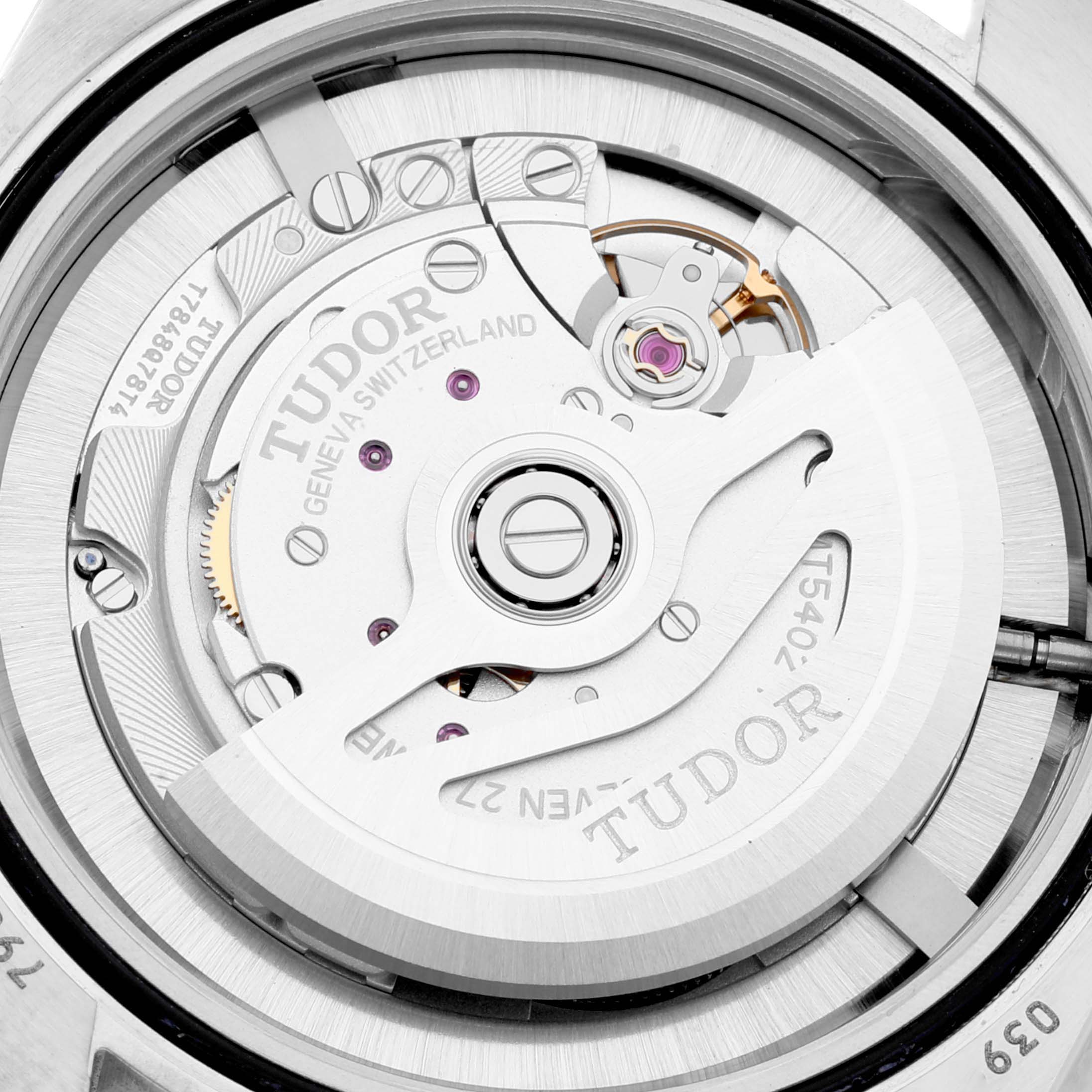 The image shows a close-up view of the Tudor Heritage Black Bay 79030B Men's Stainless Steel Blue Dial 79030B Men's Stainless Steel Blue Dial model displaying its intricate watch movement and rotor.