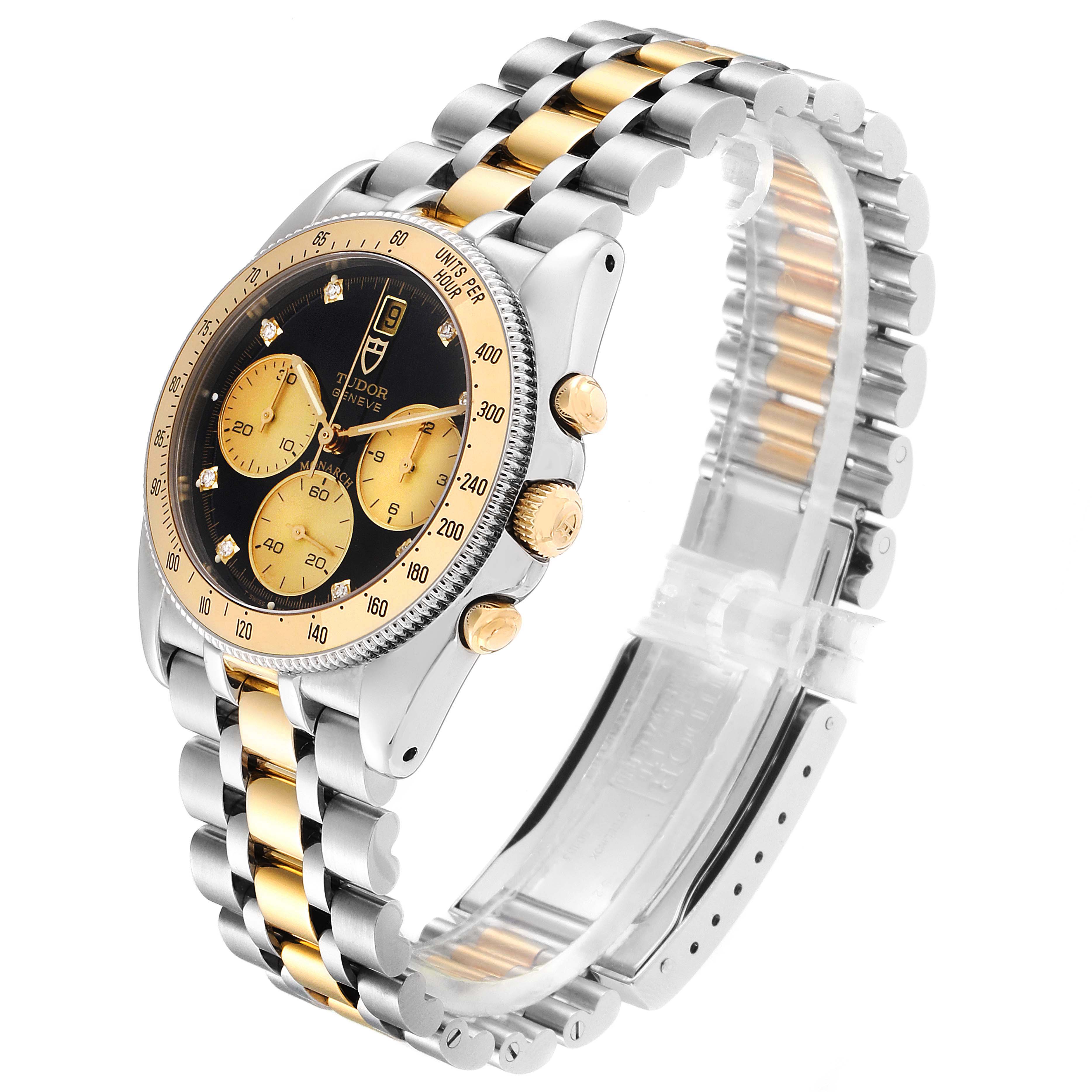 The image shows a Tudor Monarch 79180 Men
s Stainless Steel Black Dial 79180 Men
s Stainless Steel Black Dial model watch from a side angle, highlighting its bezel, dial, and two-tone metal bracelet.