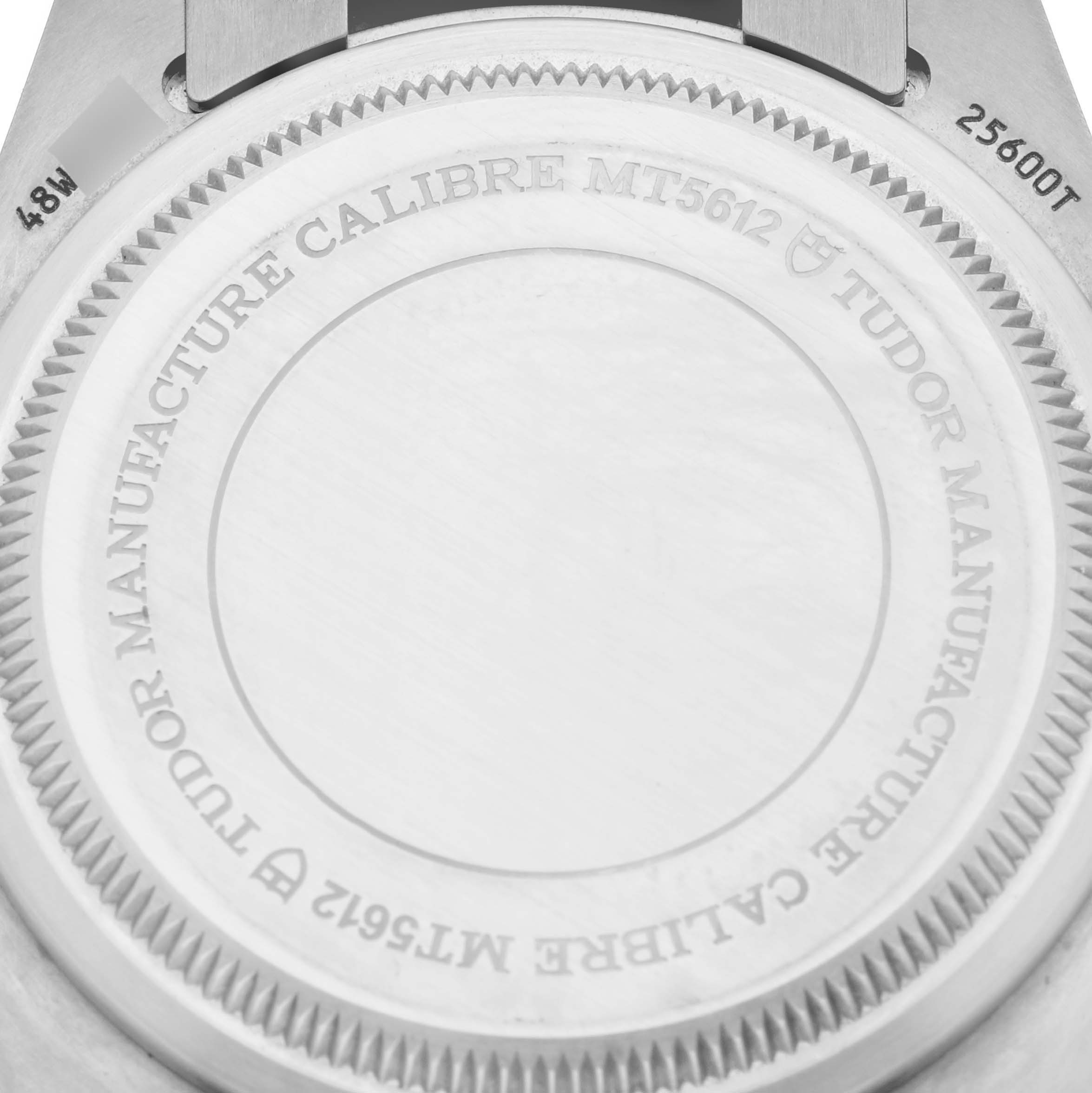 The image shows the back of a Tudor Pelagos 25600TB Men's Titanium Blue Dial 25600TB Men's Titanium Blue Dial watch, focusing on the case back and its engravings.