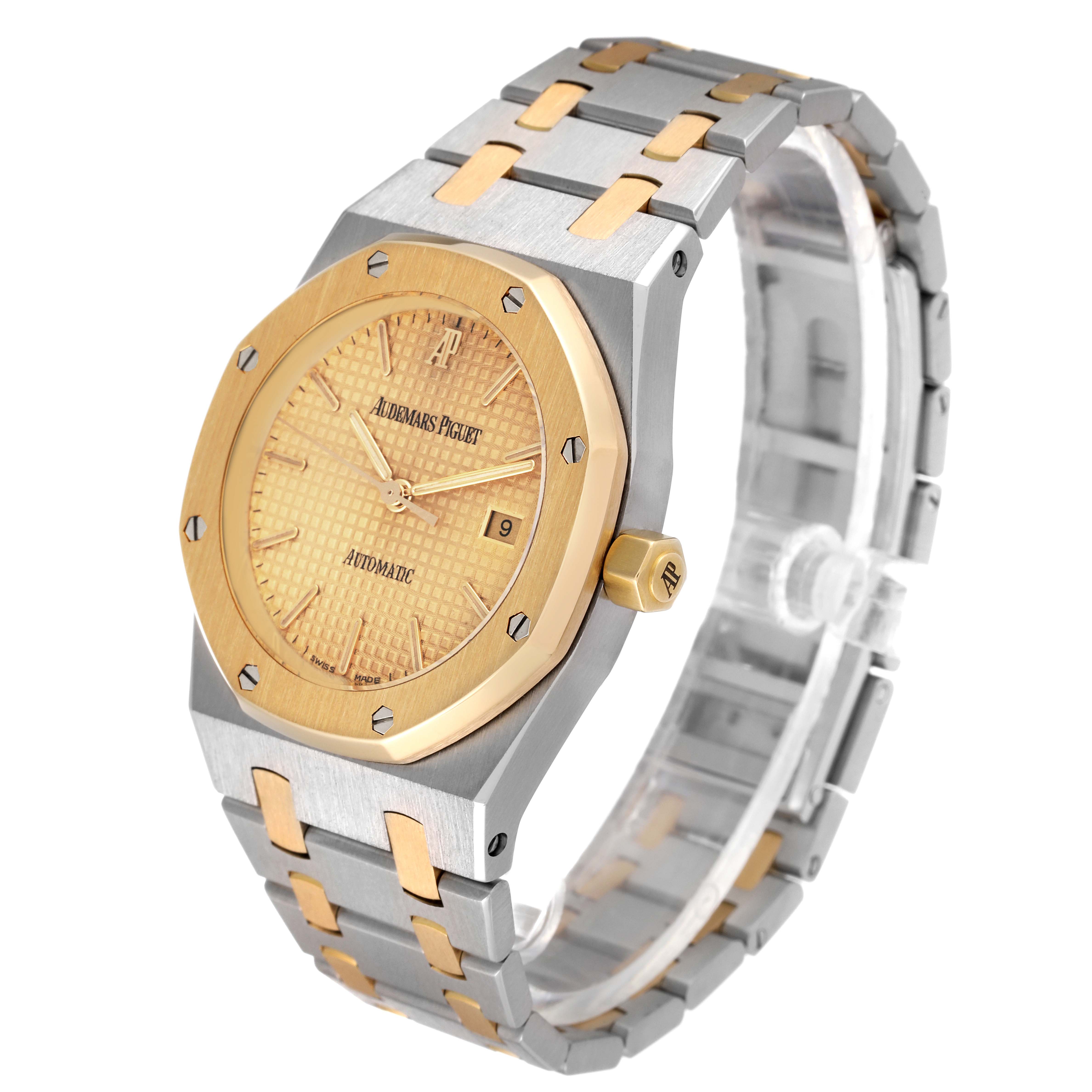 This image shows an angled view of the Audemars Piguet Royal Oak 15000SA.OO.0789SA.02 Men's Steel and Gold (two tone) Champagne Dial 15000SA.OO.0789SA.02 Men's Steel and Gold (two tone) Champagne Dial watch, highlighting its two-tone bracelet and the detailed face with a date display.