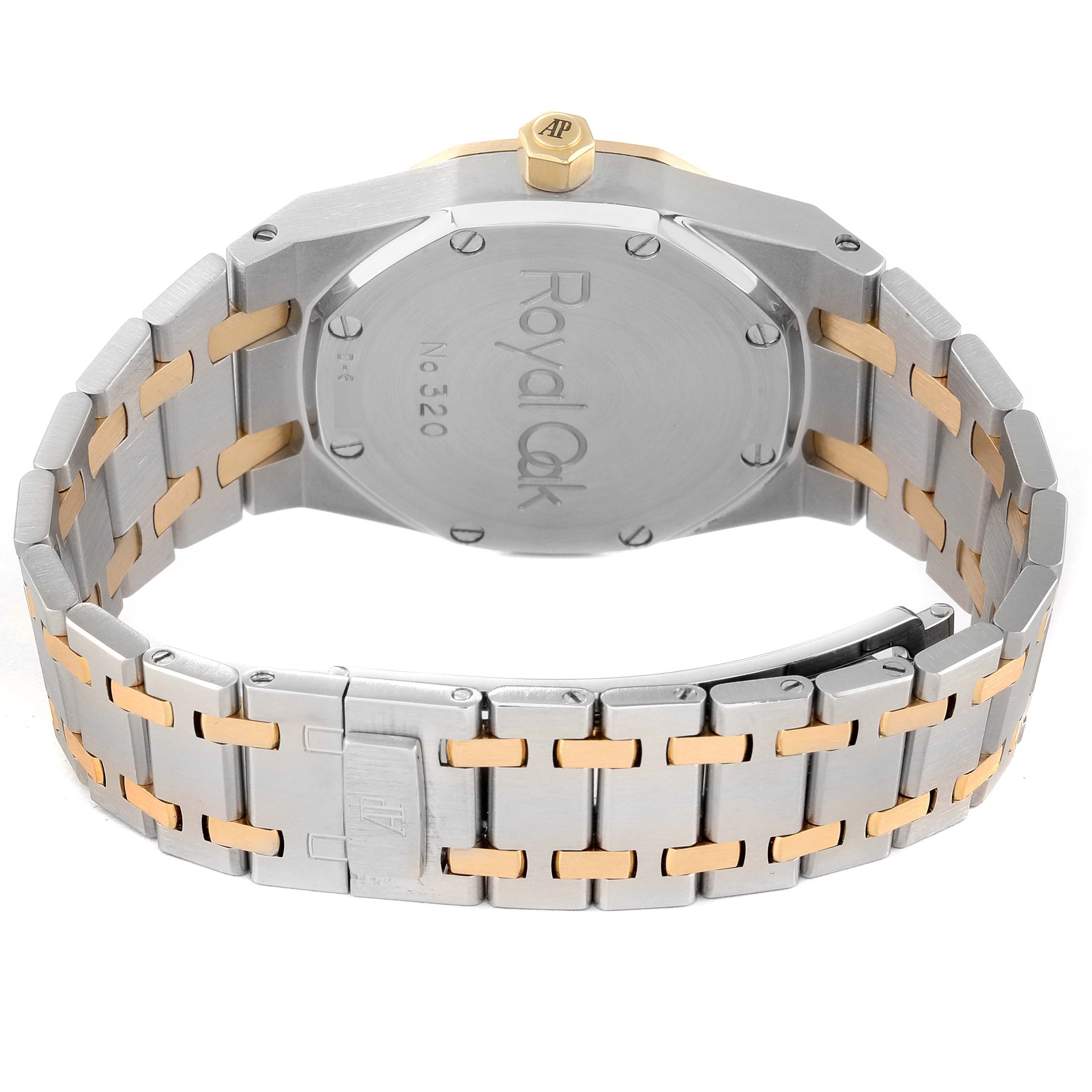 The image shows the back and bracelet of a Royal Oak model by Audemars Piguet, highlighting the case back and two-tone metal links.