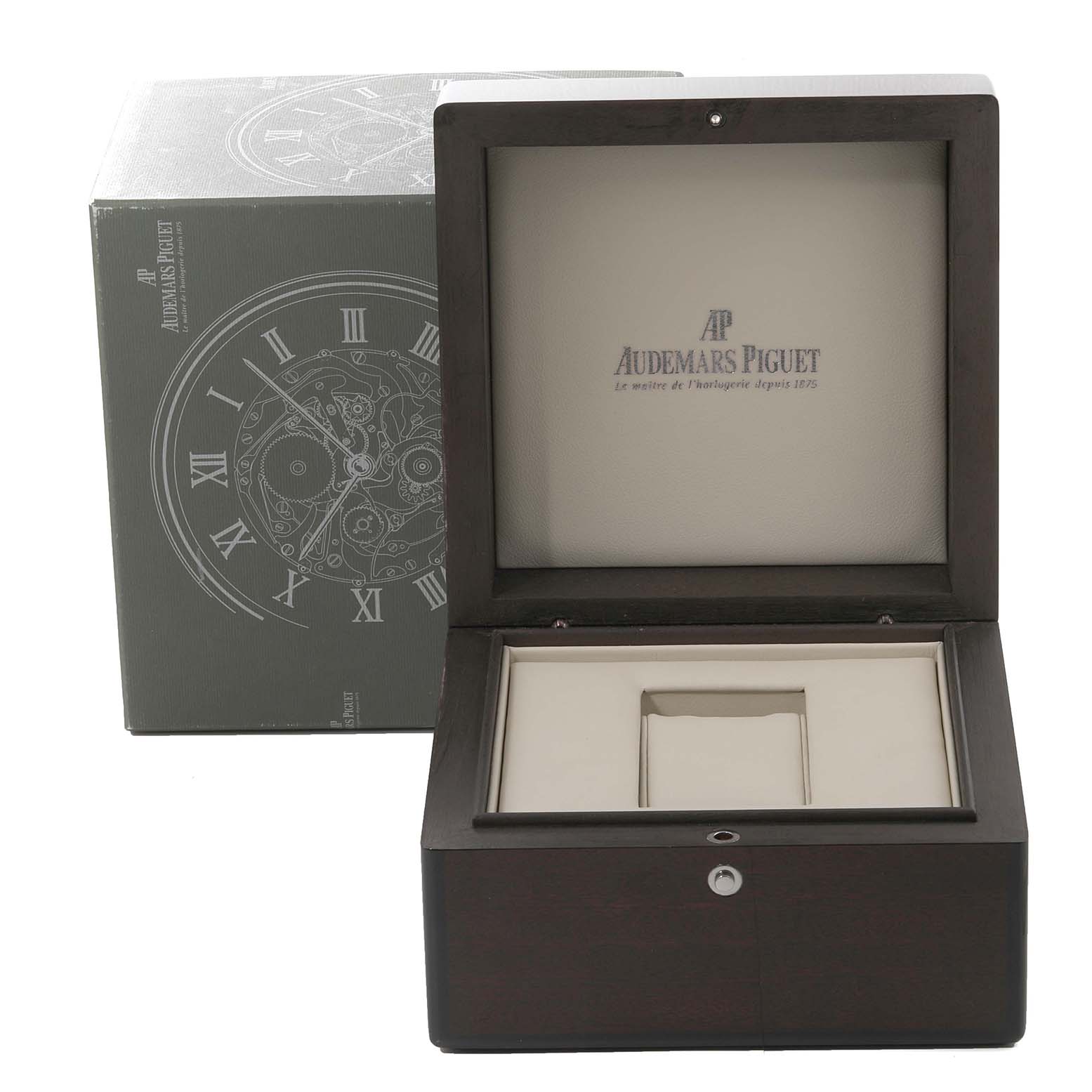 The image shows an open watch box for a Royal Oak model by Audemars Piguet, with the original packaging in the background.